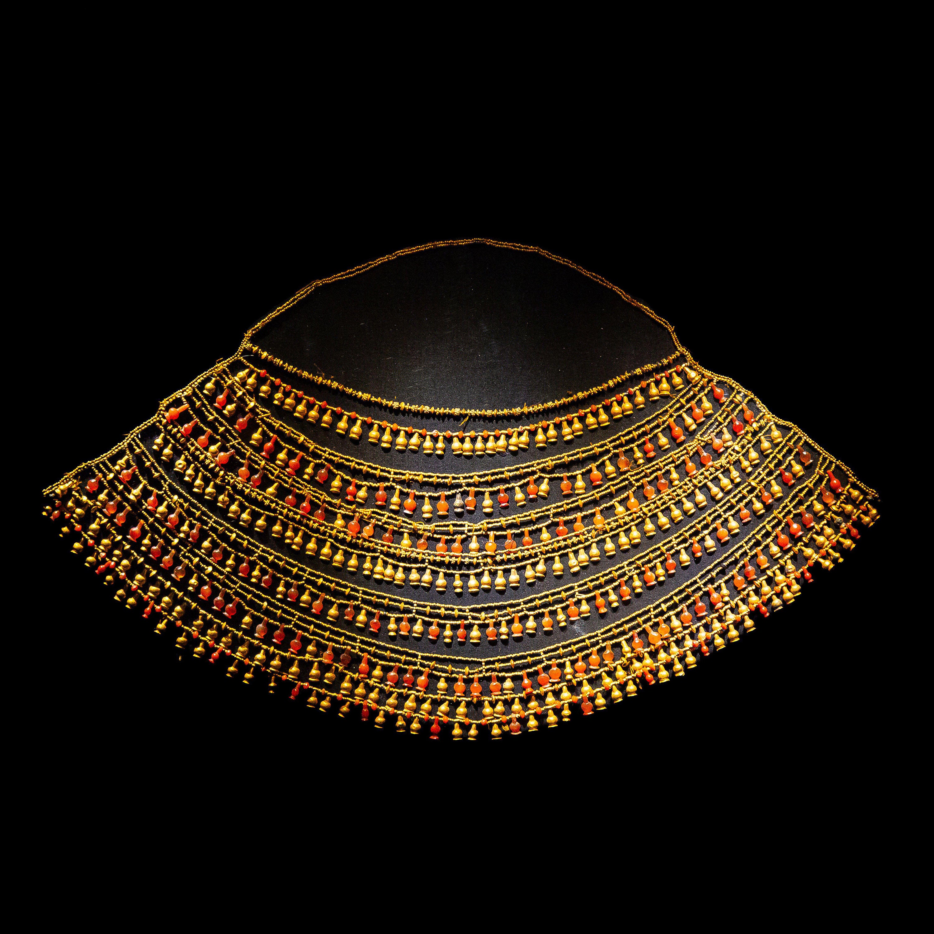 Traditional Egyptian usekh necklace featuring gold and carnelian-style beadwork.