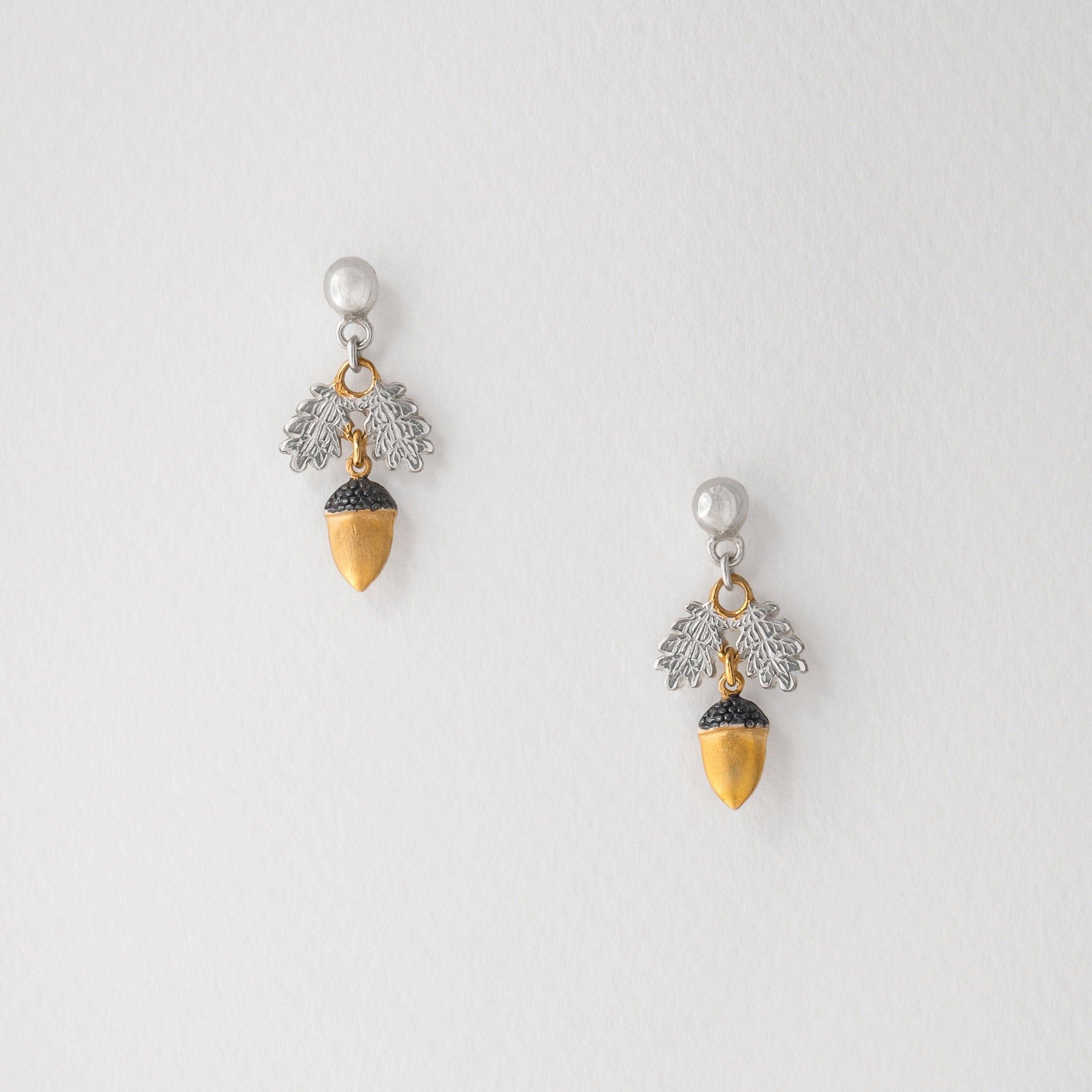 pair of acorn stud earrings in sterling silver and 18 carat gold plate
