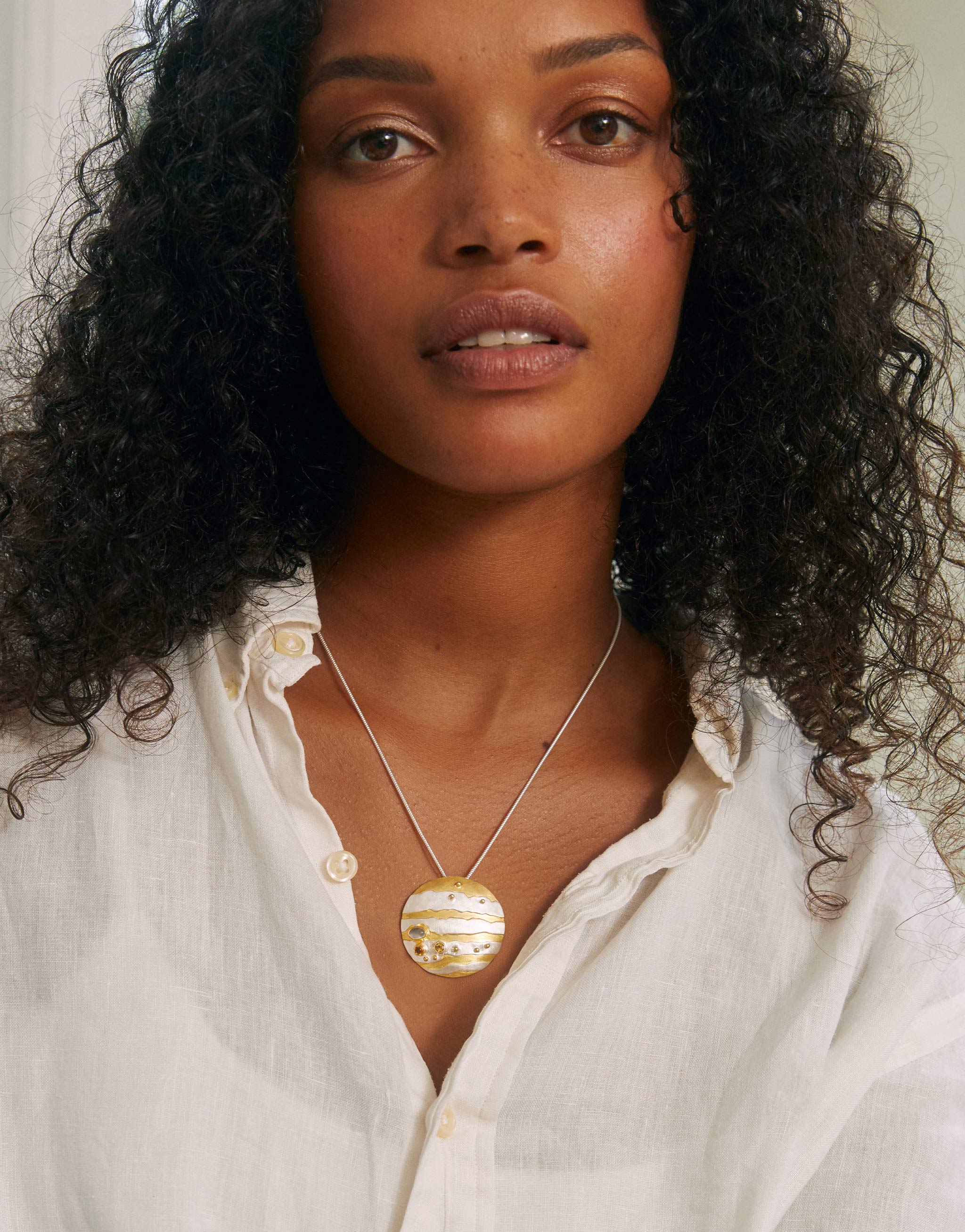 Jupiter planet pendant necklace in sterling silver and gold design with citrine and moonstone gems.