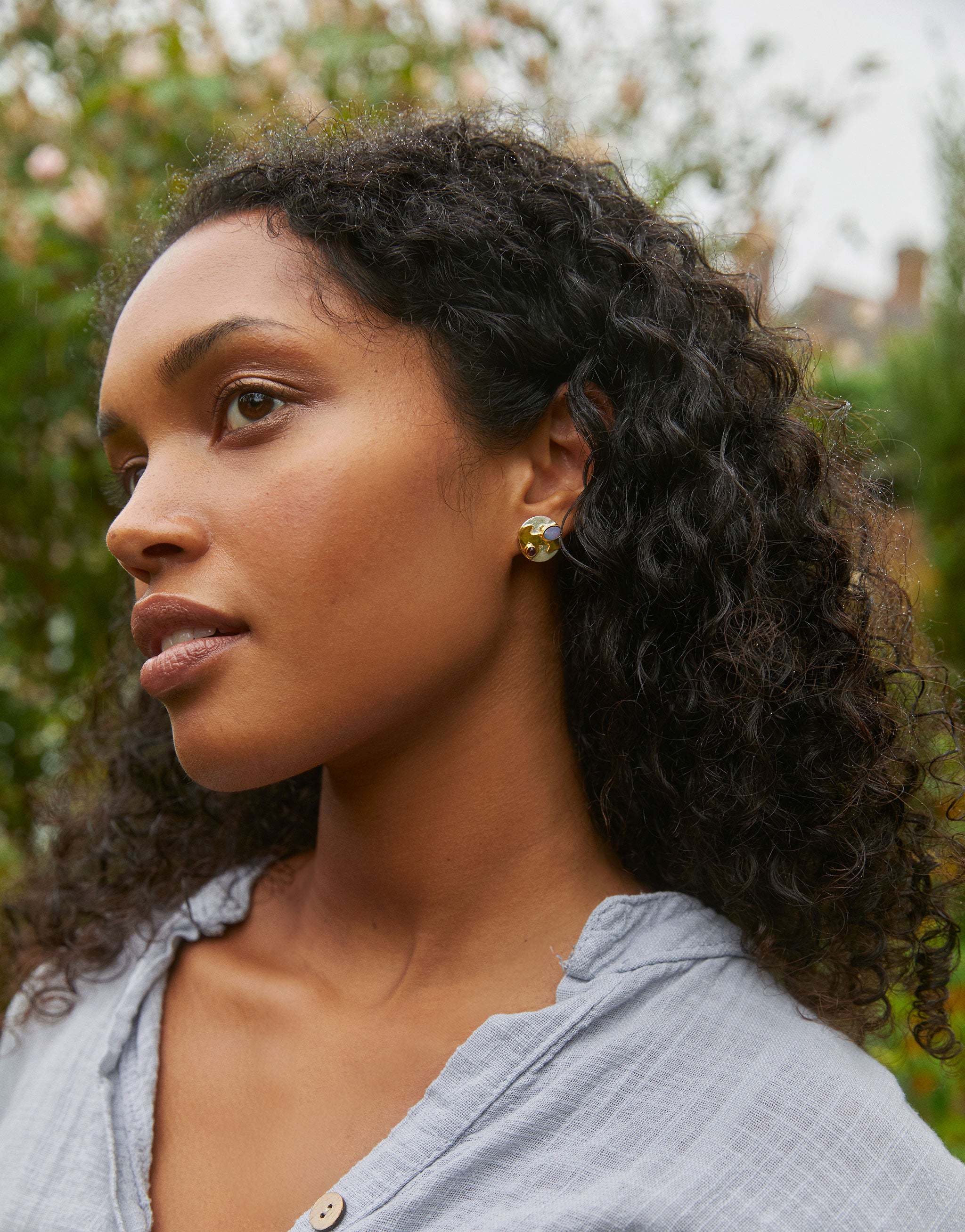 Art-inspired earrings with silver, opal and amethyst gemstones evoking Monet’s water garden.