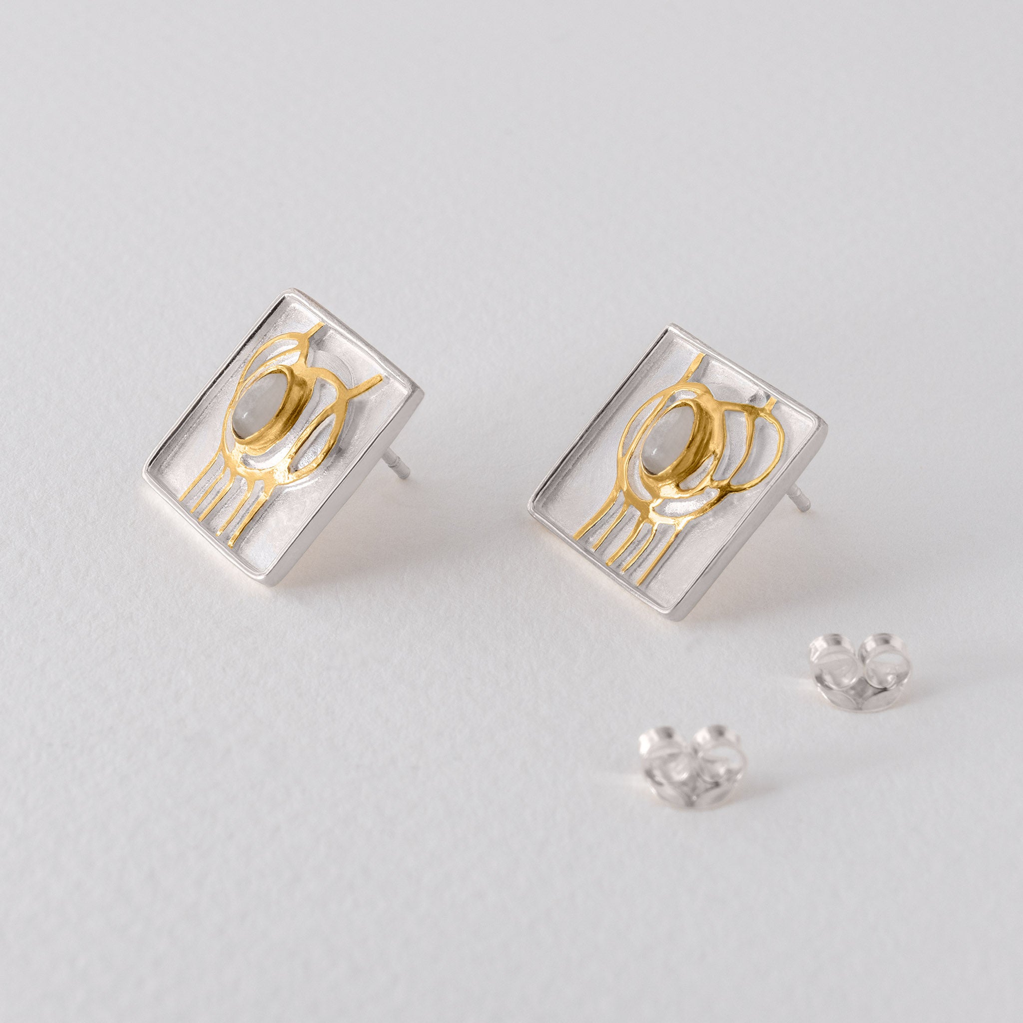 Art Nouveau style Mackintosh earrings with silver, gold accents and moonstone gemstone.