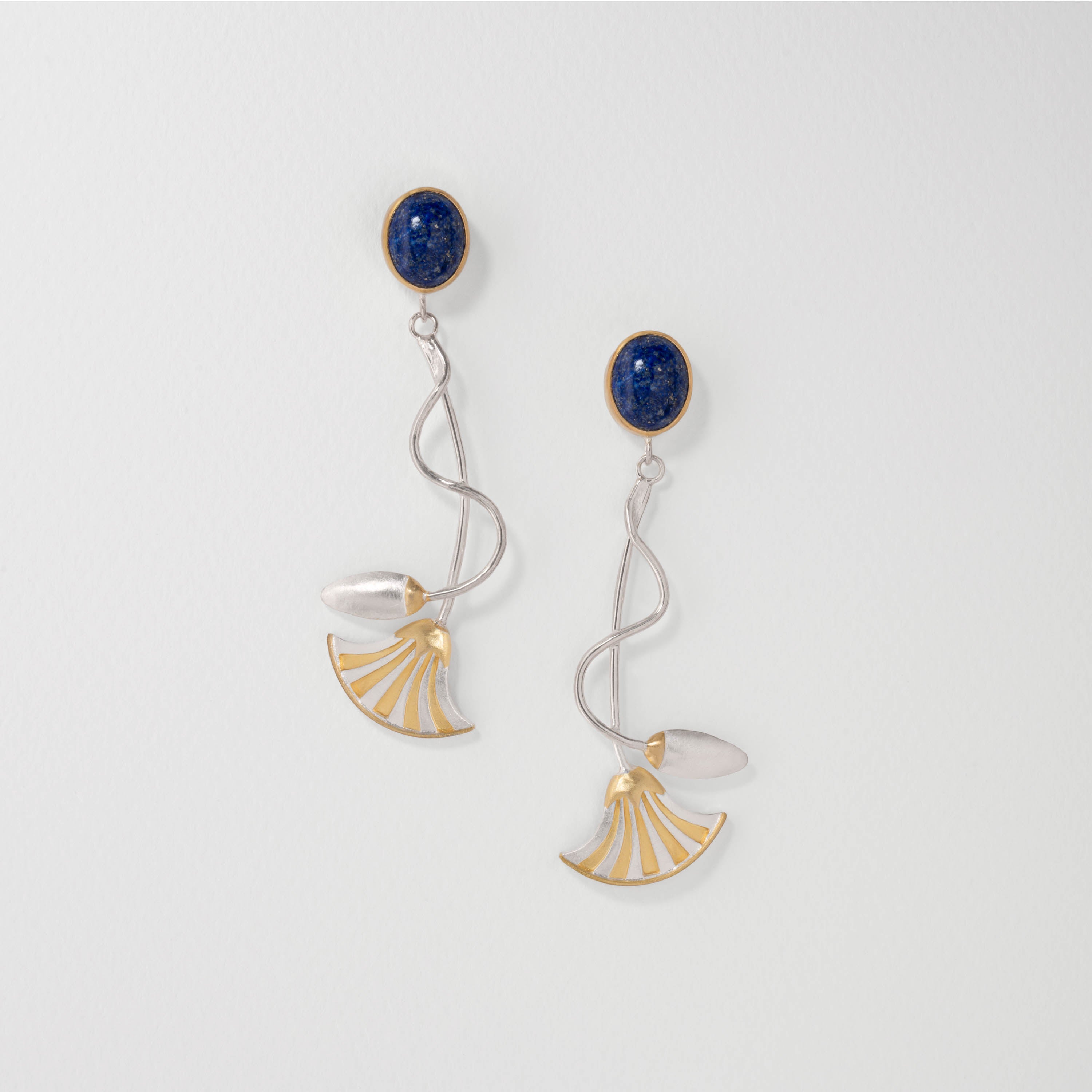 Ancient Egyptian lotus flower drop earrings in sterling silver with 18ct gold plate and lapis lazuli. Elegant handcrafted jewellery symbolising the sun, creation and rebirth.