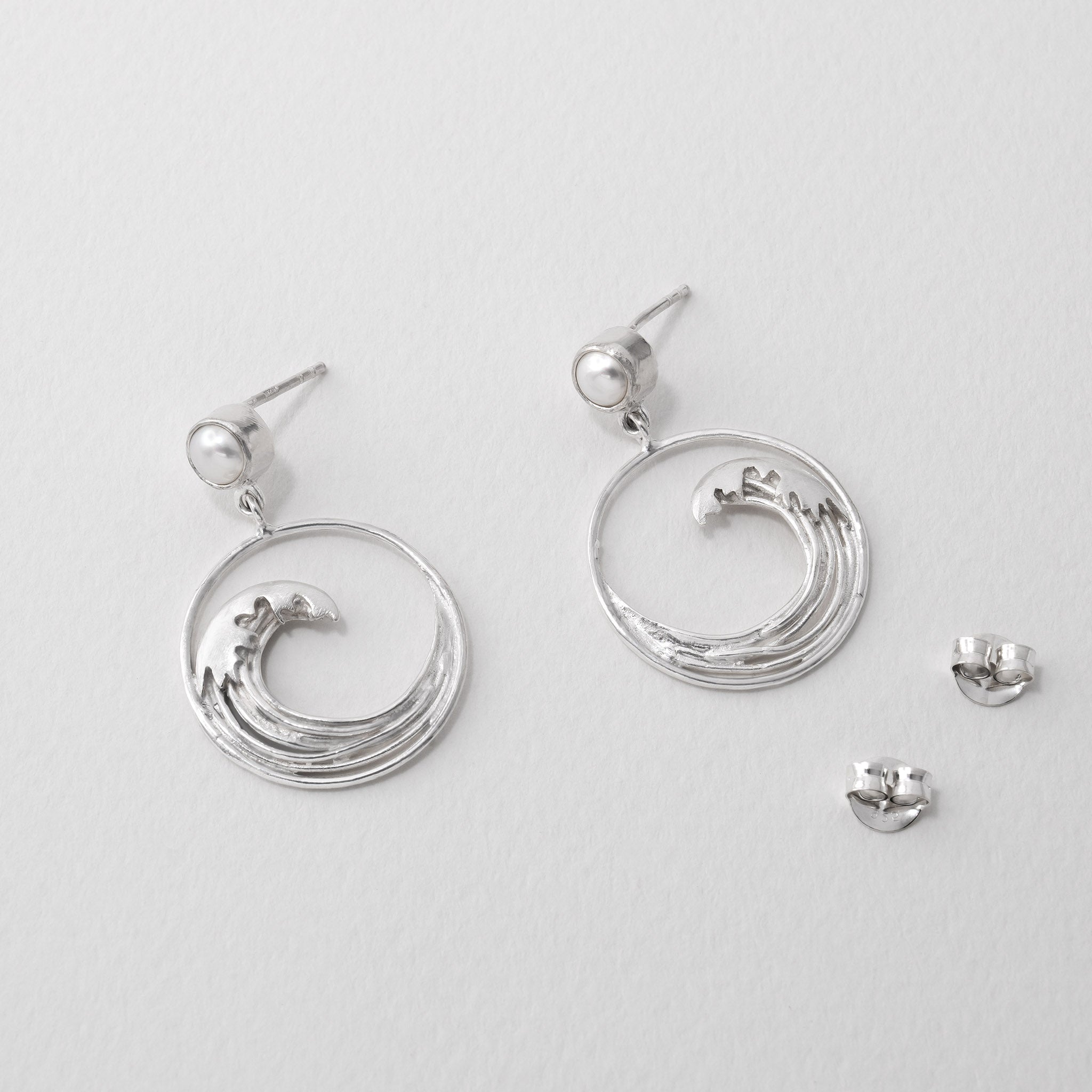 Great Wave inspired drop earrings in silver with pearl, homage to Hokusai’s iconic art.