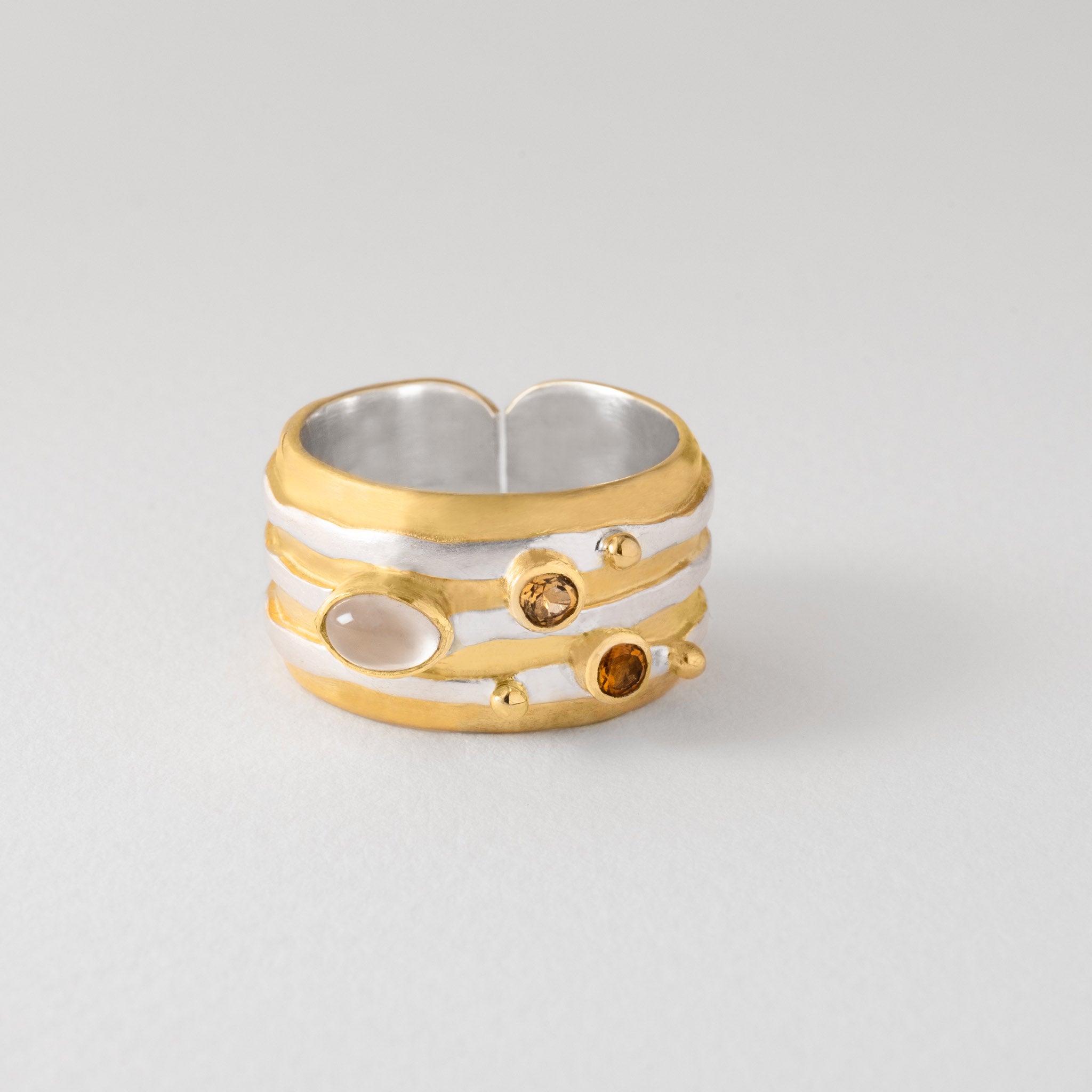 Astronomy inspired Jupiter ring in silver with gold-plated detail, moonstone and citrine.
