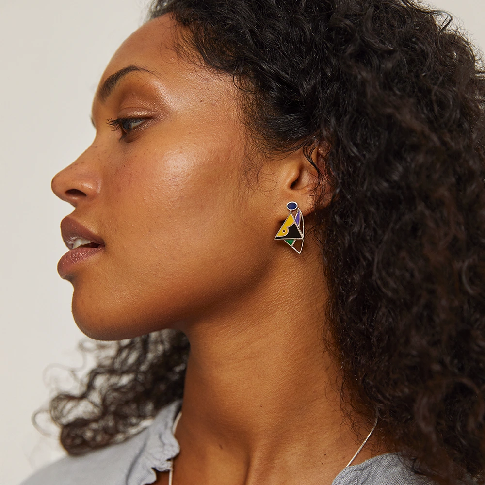 Colourful resin geometric earrings in sterling silver with yellow, blue, purple, green and black details.