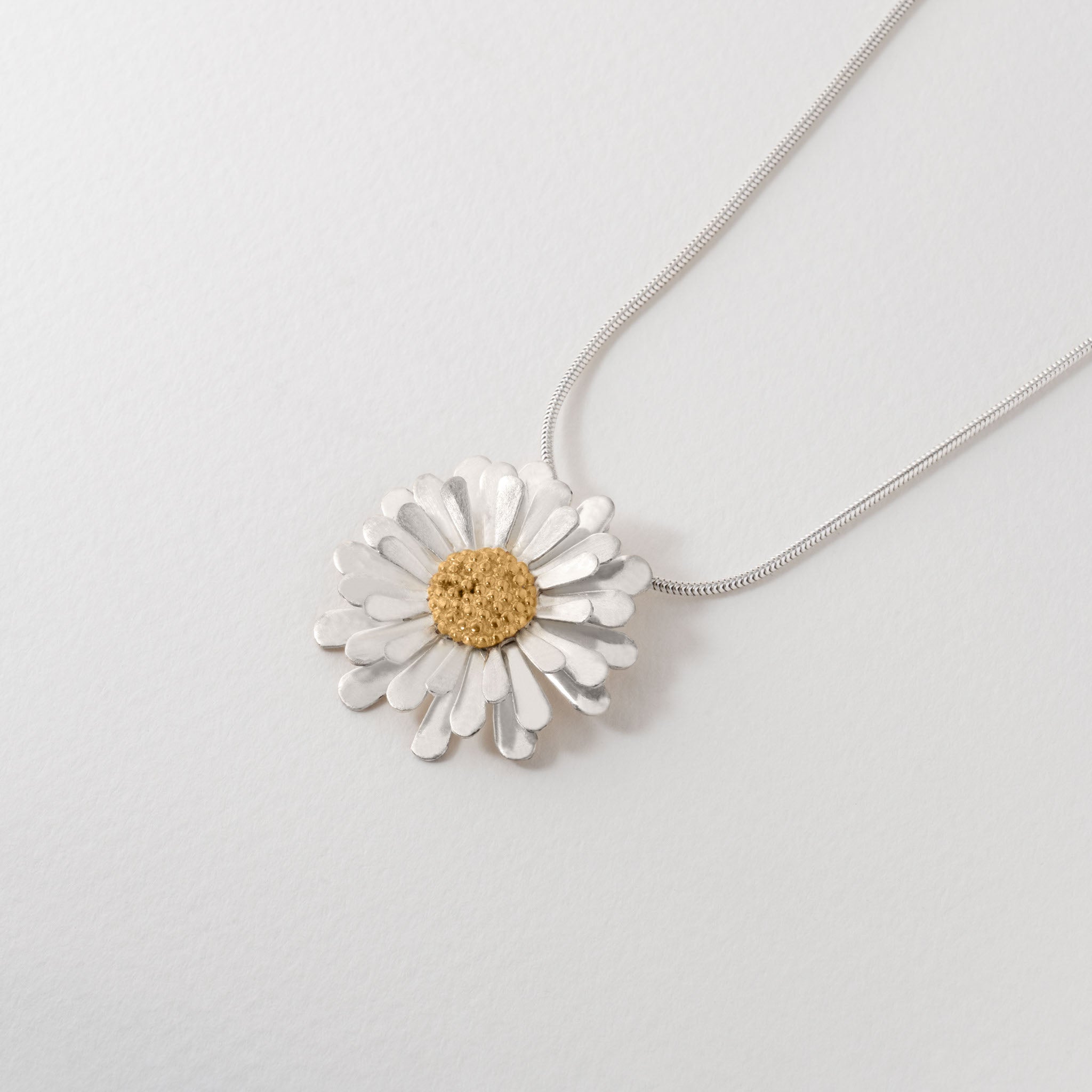 Aster flower pendant necklace with silver chain, silver petals and 18 carat gold-plated centre