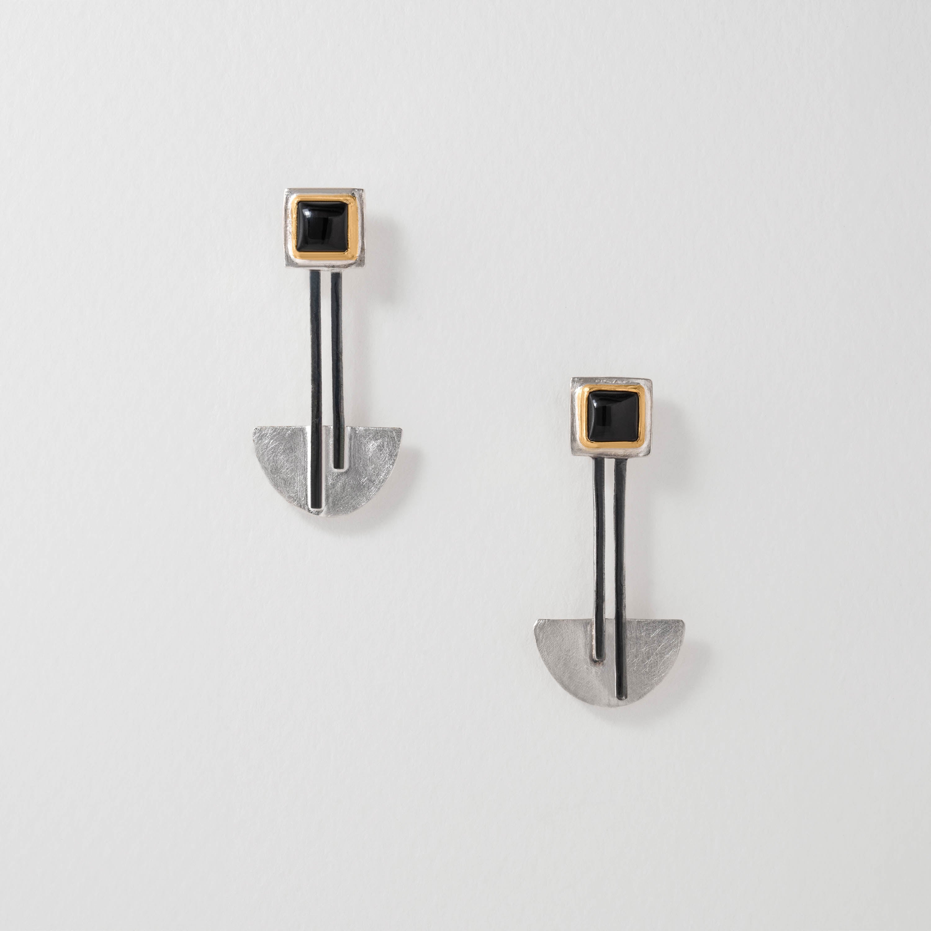 Bauhaus inspired earrings in sterling silver with 18ct gold plate and black onyx. The geometric design balances simplicity and functionality, echoing the Bauhaus “less is more” philosophy in wearable art form.