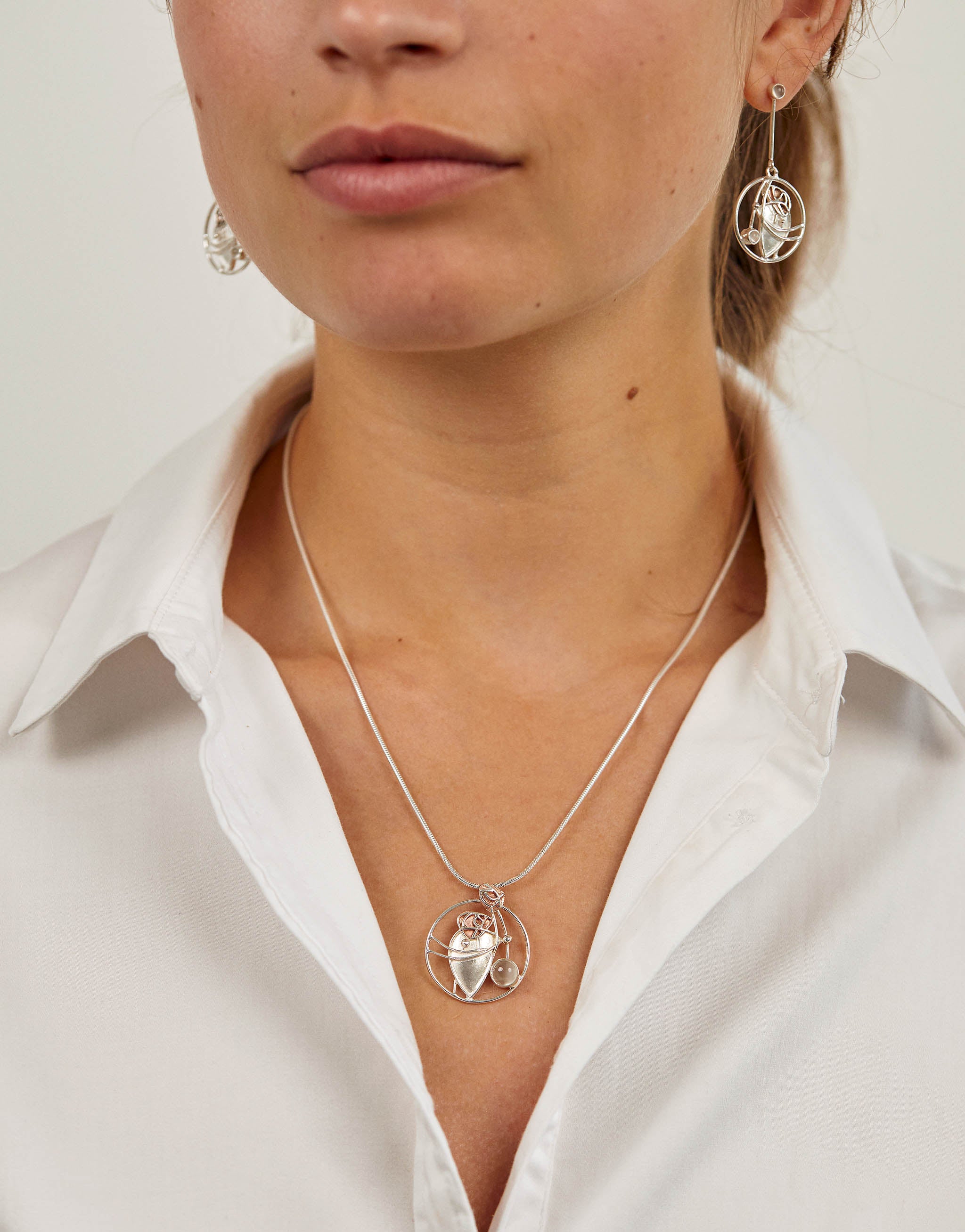 Silver Art Nouveau pendant necklace inspired by the work of Charles Rennie Mackintosh designs