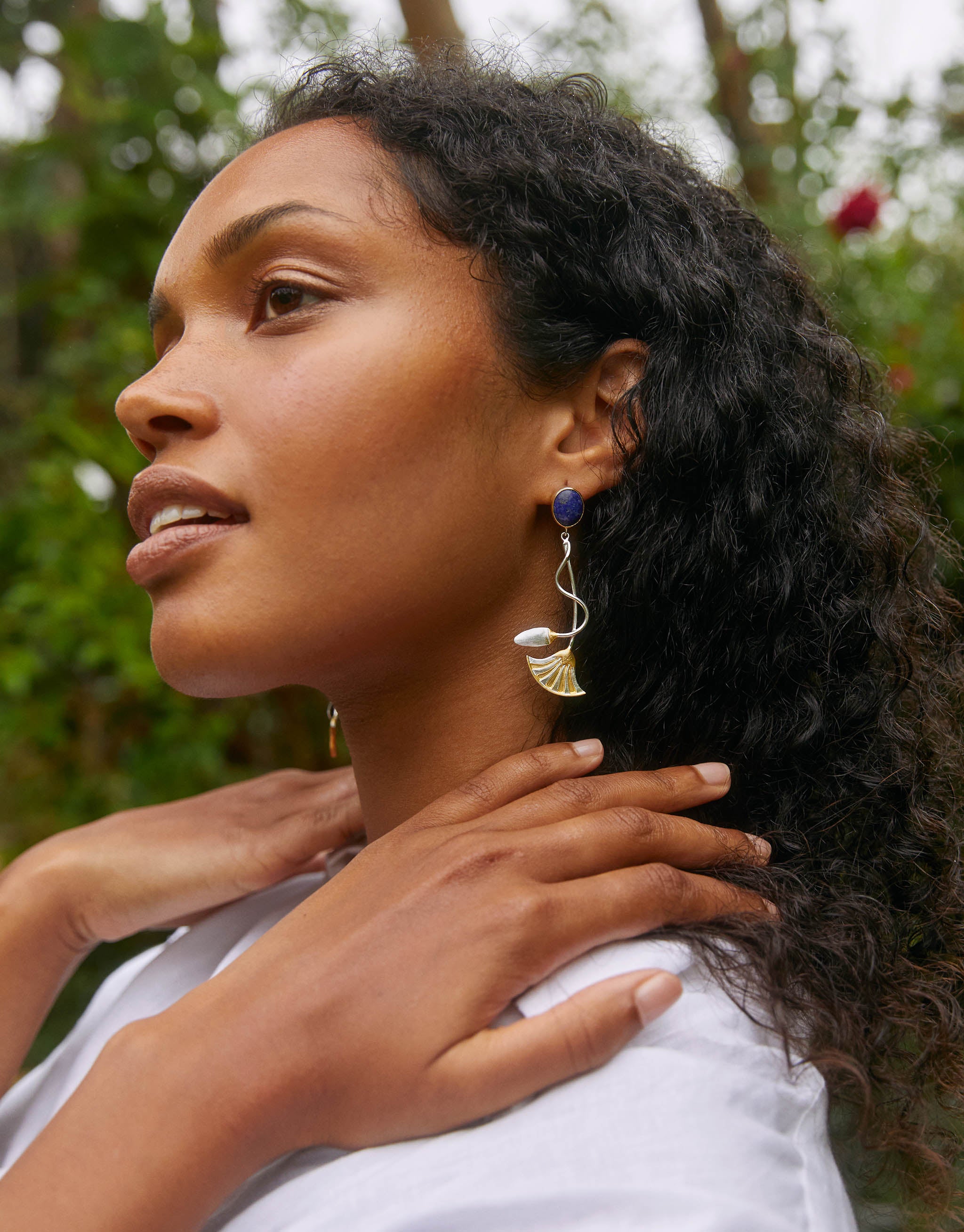 Egyptian lotus flower drop earrings in sterling silver with 18ct gold plate and lapis lazuli, inspired by ancient symbols of the sun, creation and rebirth. Elegant 6.4cm statement earrings with historic design.