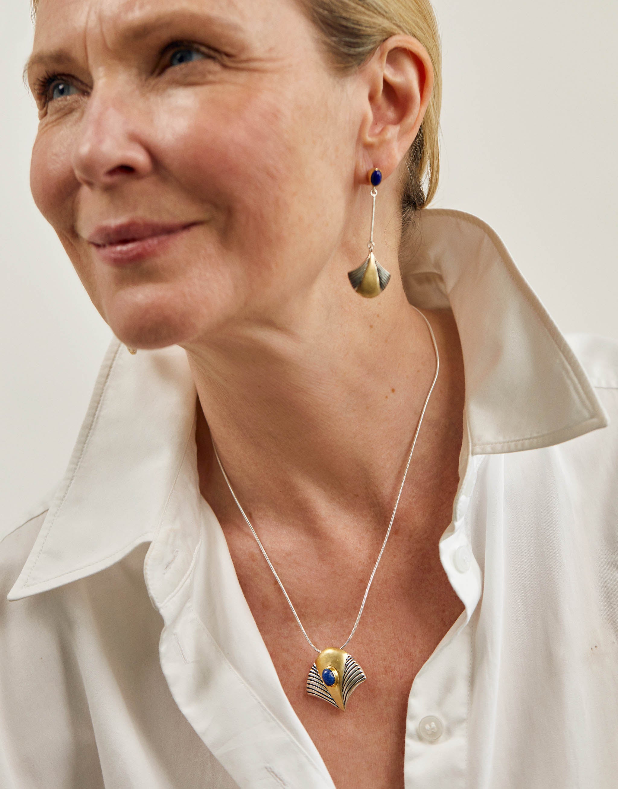 Egyptian Tutankhamun jewellery set with stud earrings and pendant necklace in sterling silver with 18ct gold plate and lapis lazuli, inspired by the iconic mask of Tutankhamun.