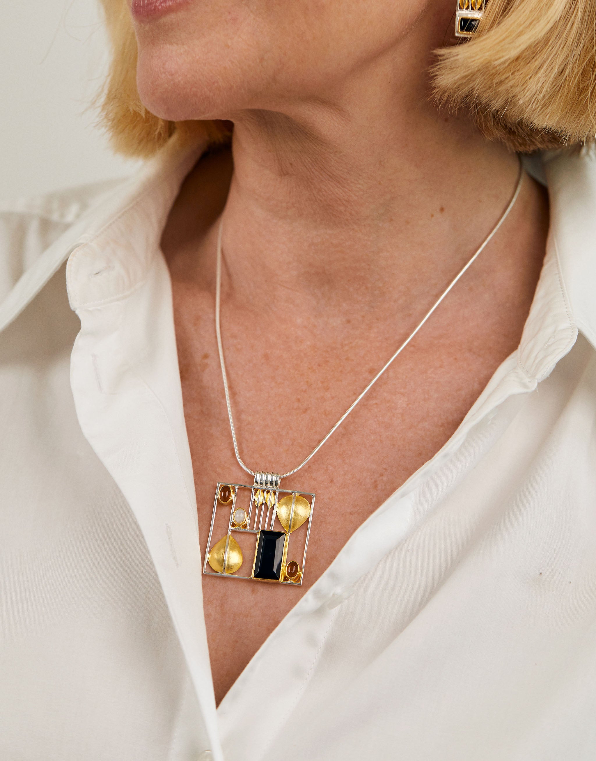 Vienna Secession inspired Hoffmann necklace in silver with amber and onyx detail.