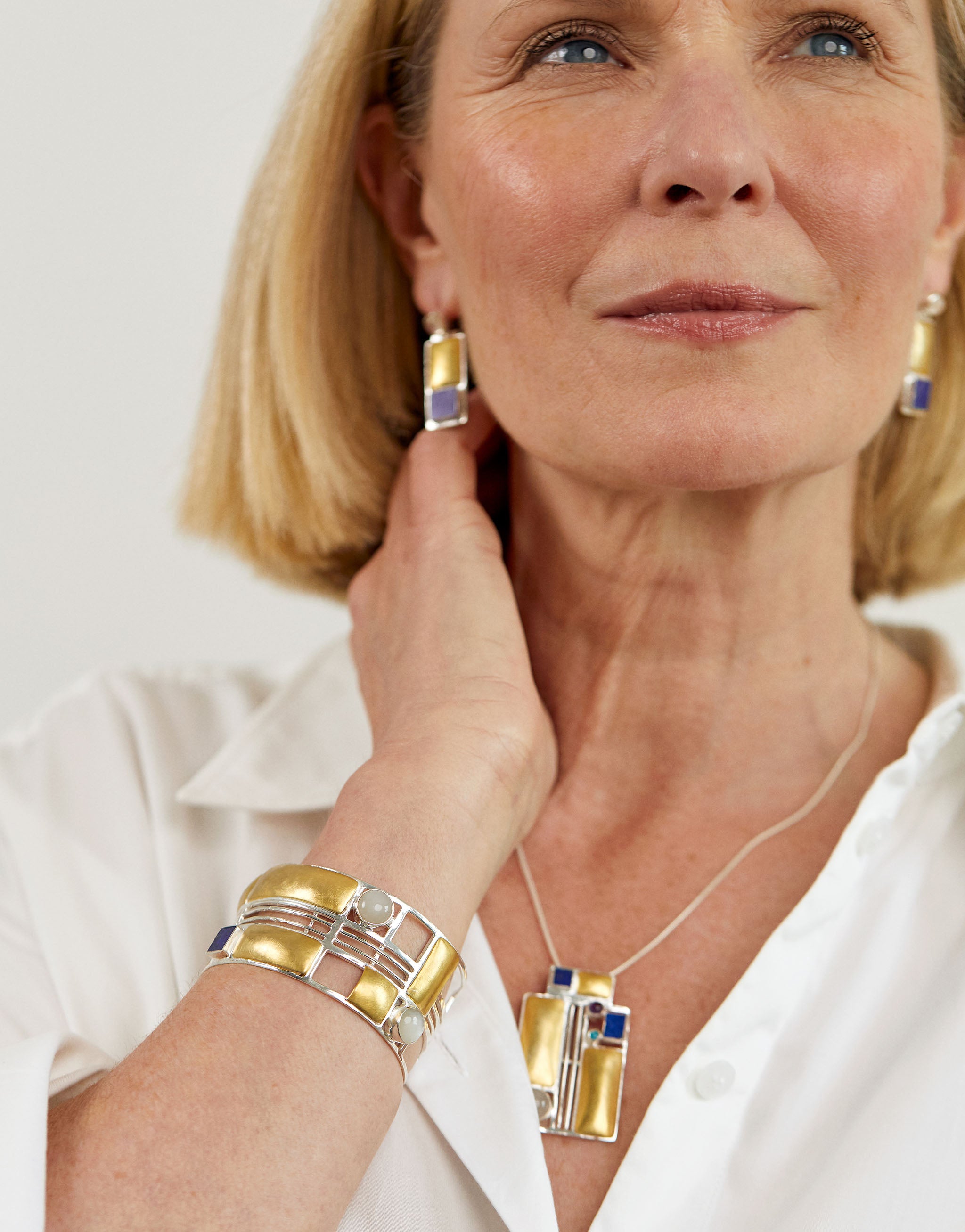 Hoffmann Vienna earrings in sterling silver with 18ct gold plate, lapis lazuli and moonstone.