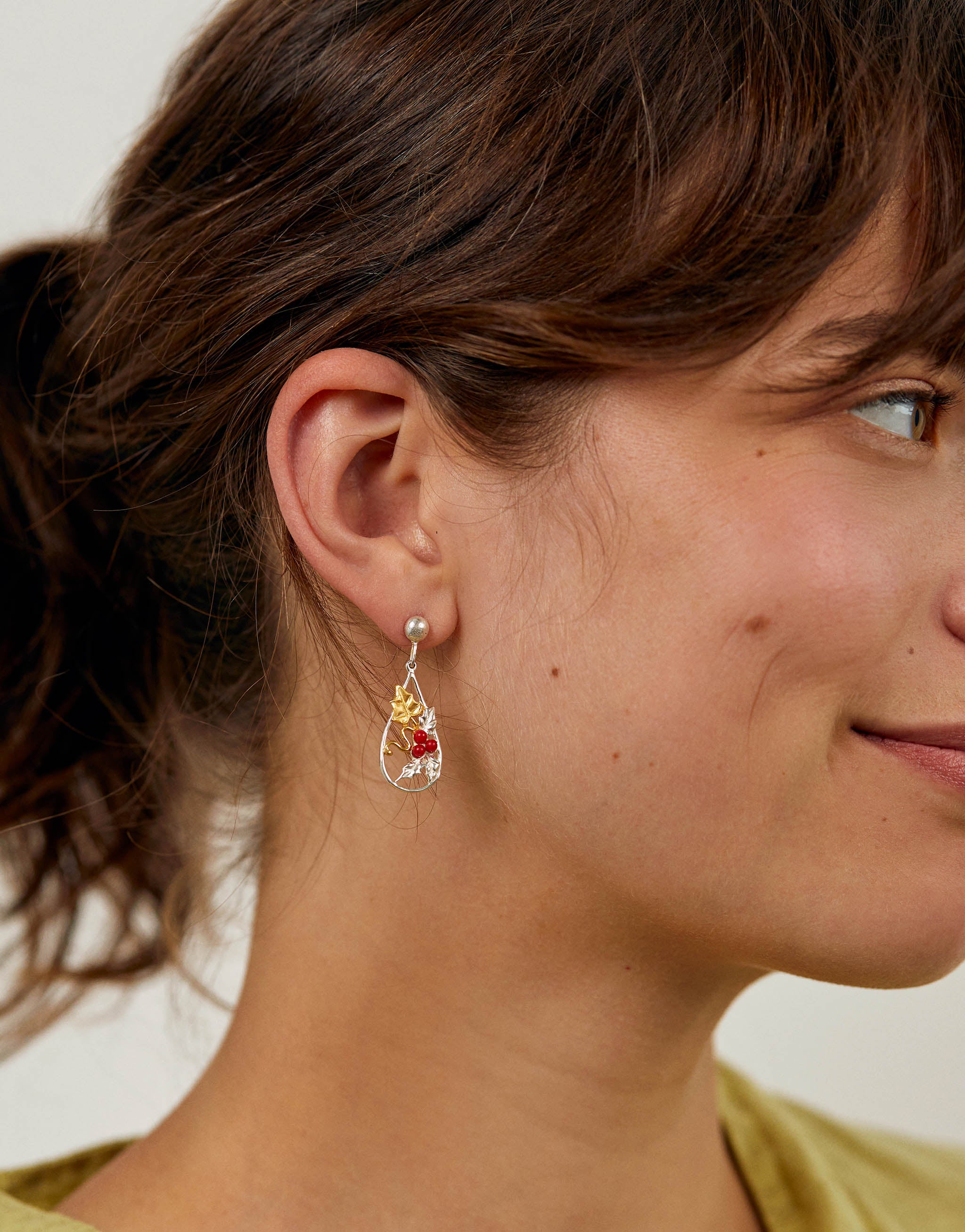 Sterling silver and 18ct gold plated Holly Earrings with teardrop design, featuring detailed holly leaves and vibrant coral berries. Elegant festive earrings, 3cm length, perfect for seasonal wear.