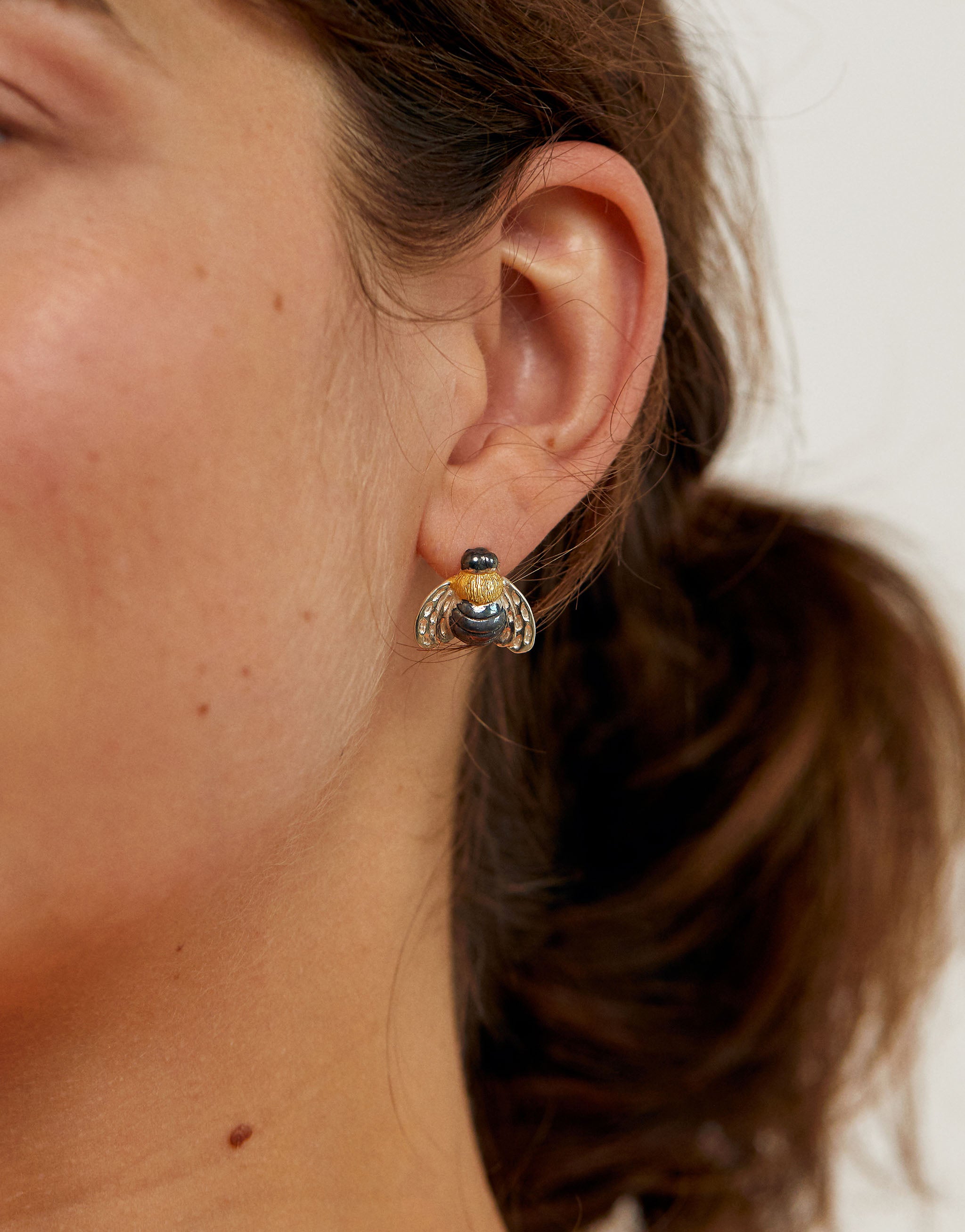 Honeybee stud earrings in sterling silver with gold-plated oxidised body.