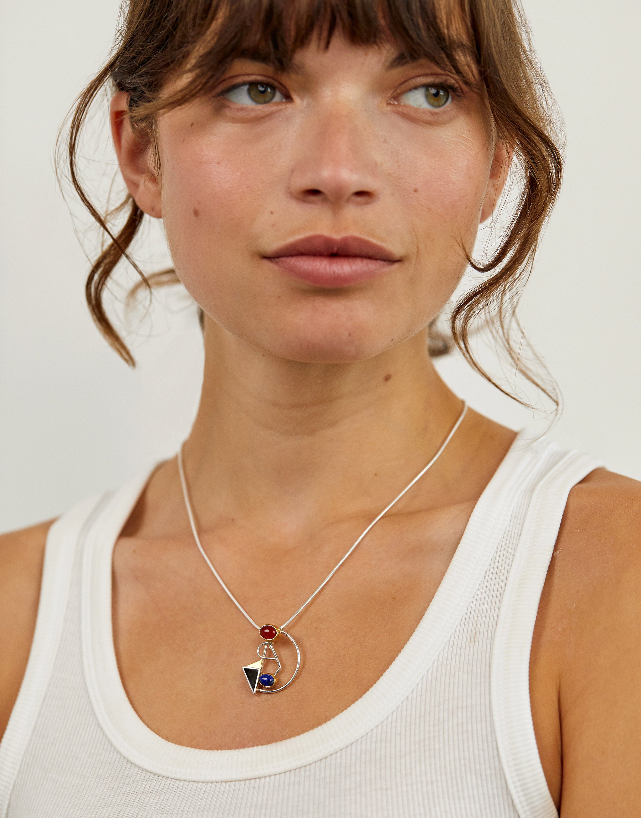 Abstract Wassily Kandinsky style necklace with geometric silver pendant and colourful gemstones.