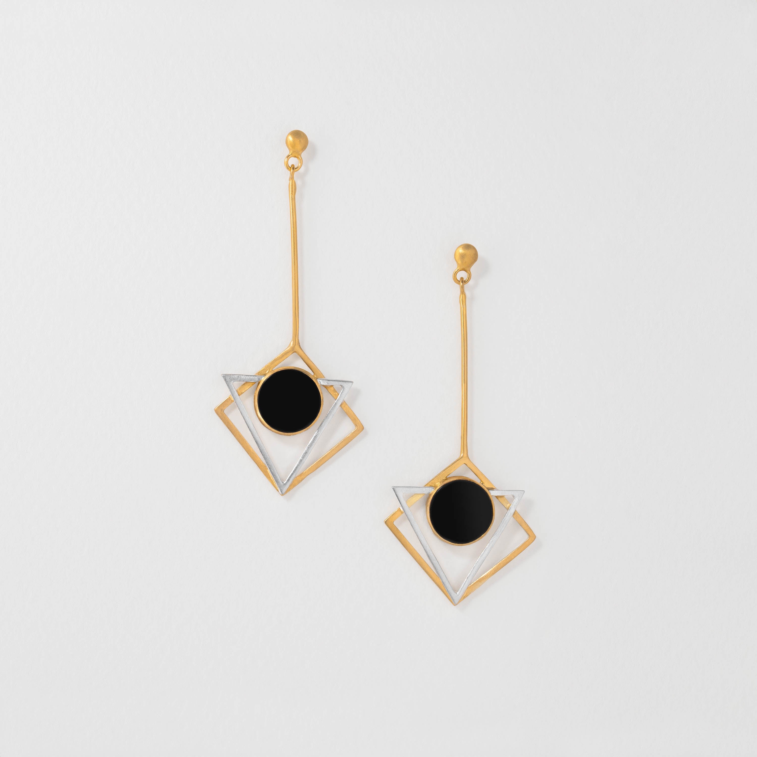 Triangular Art Nouveau earrings inspired by Gustav Klimt, featuring sterling silver with radiant gold plating and black resin. Modern geometric jewellery echoing his iconic patterns and artistry.