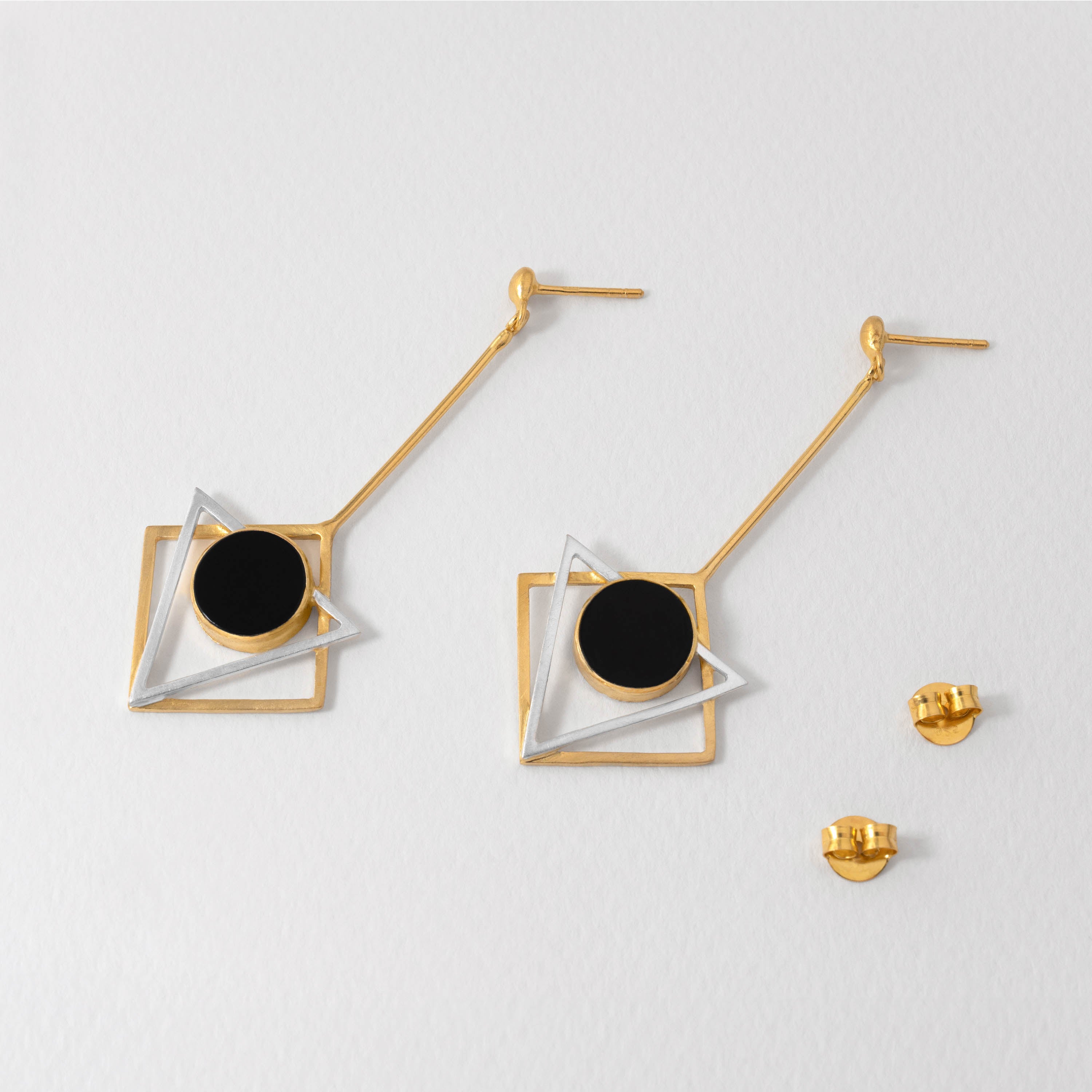 Gustav Klimt inspired geometric earrings with triangular design, crafted in sterling silver with gold-plated accents and black resin. Bold statement jewellery celebrating his iconic style.