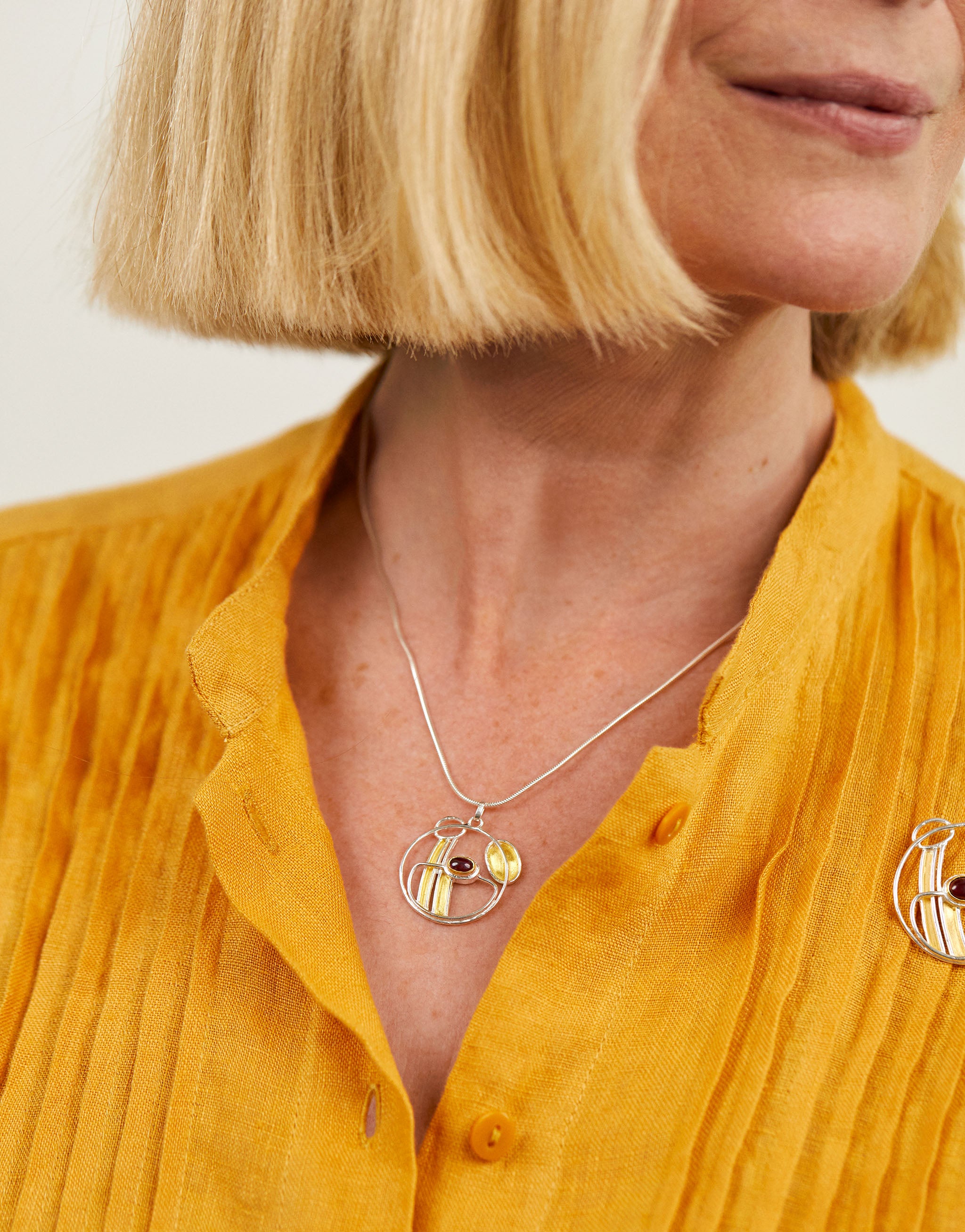 C R Mackintosh Inspired Garnet Necklace with silver, gold and garnet.