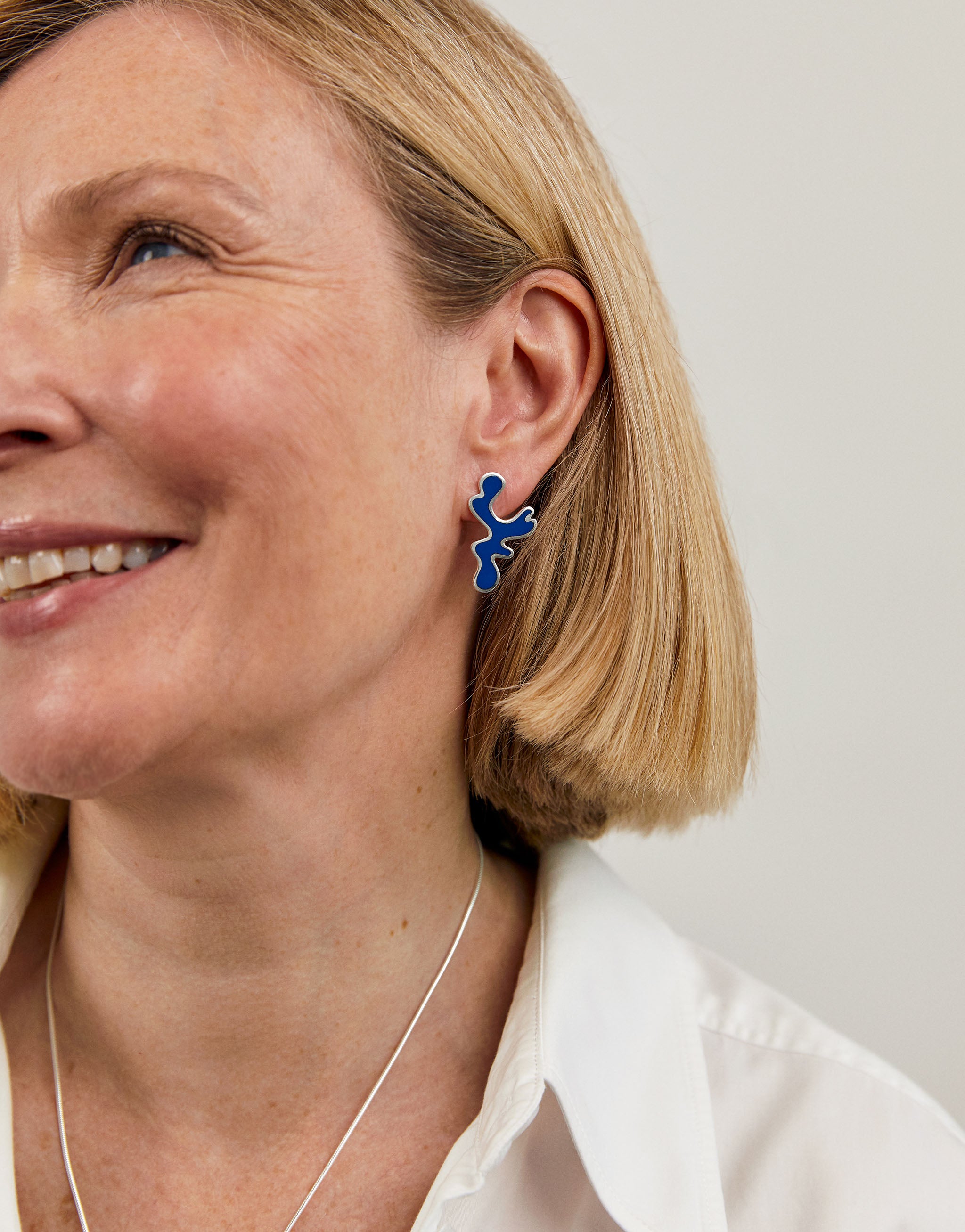 Sterling silver Matisse earrings featuring organic blue resin cutout shapes.