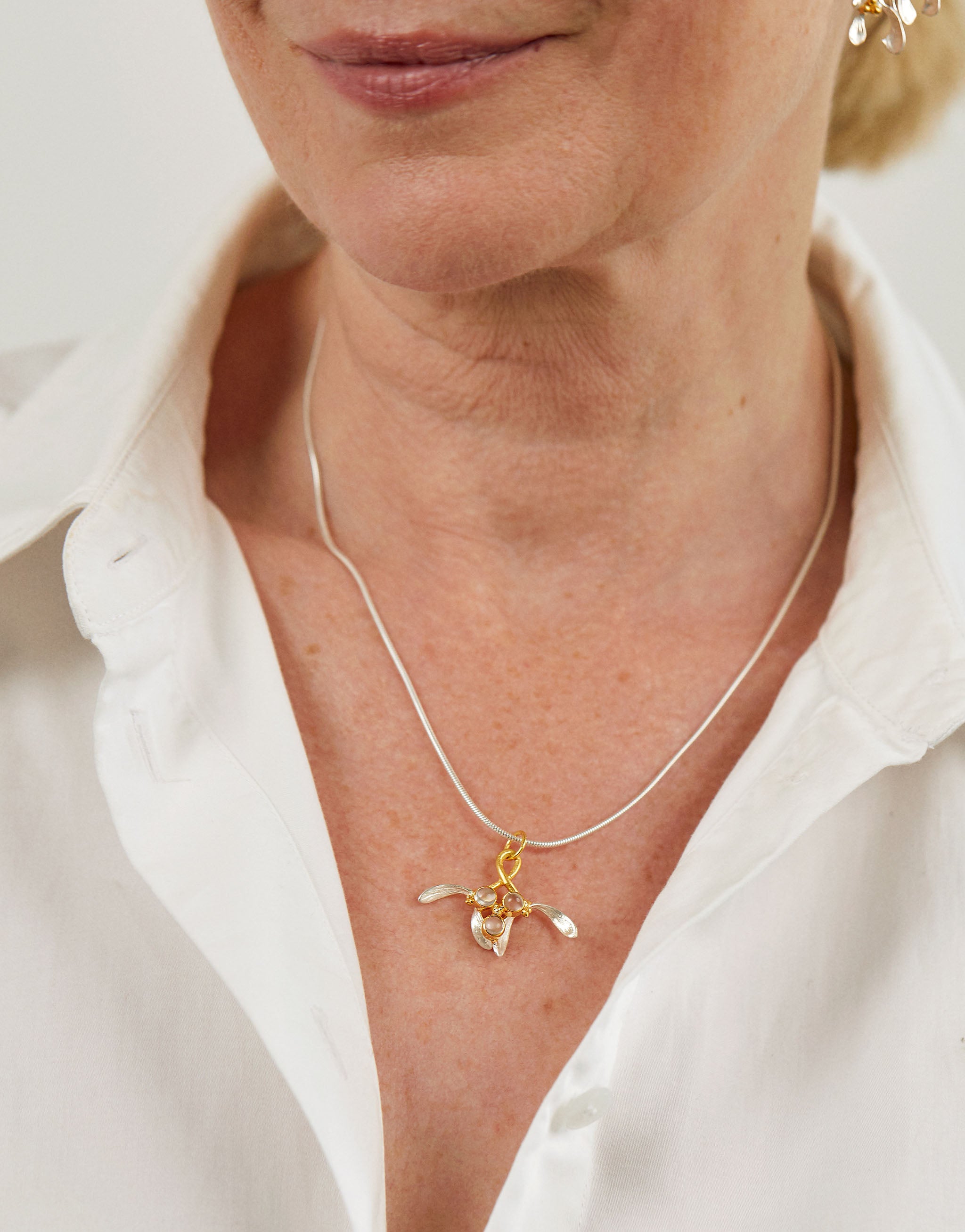 Mistletoe necklace in sterling silver with 18ct gold plate and moonstone accents.
