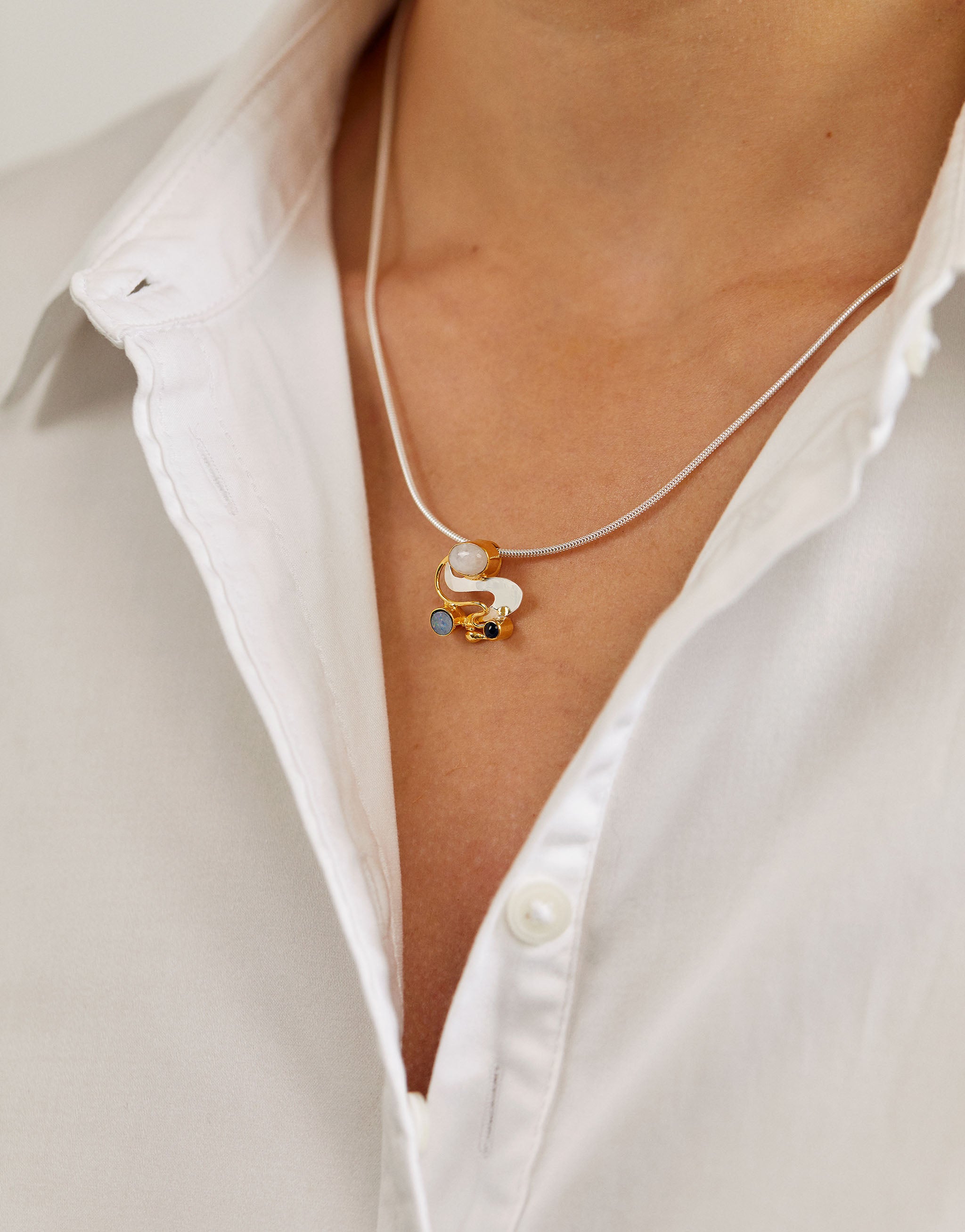Sterling silver and gold-plated Monet necklace featuring opal, moonstone and iolite.