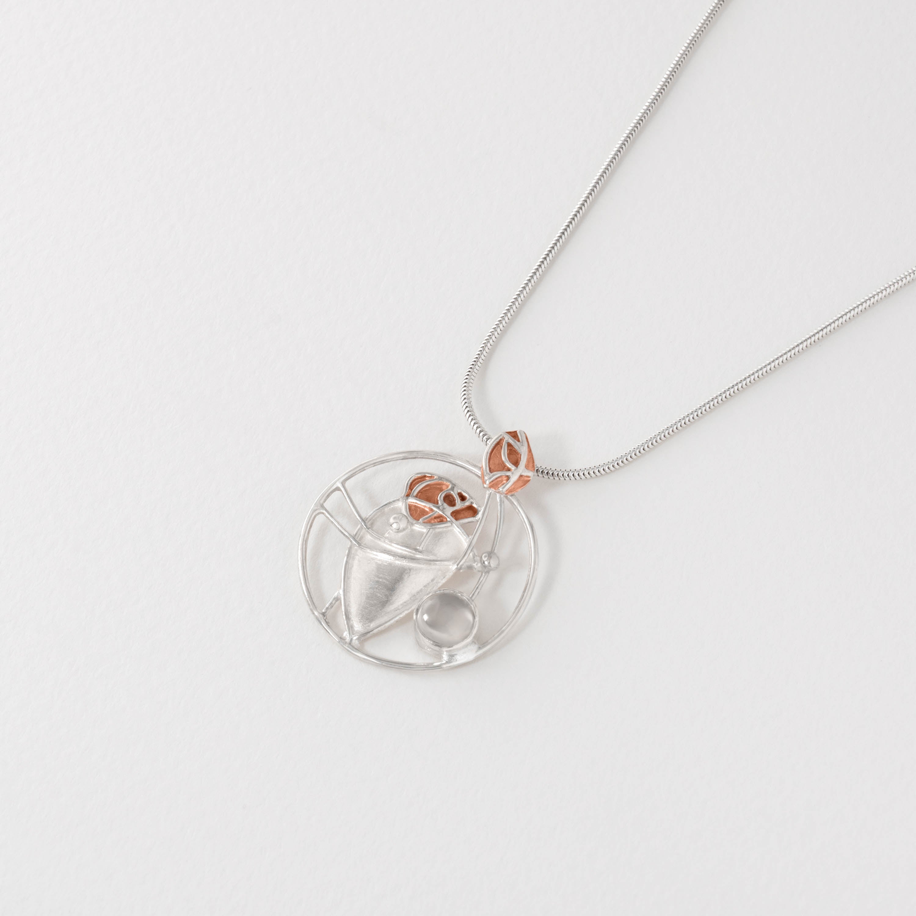 Moonstone silver necklace with bronze details.