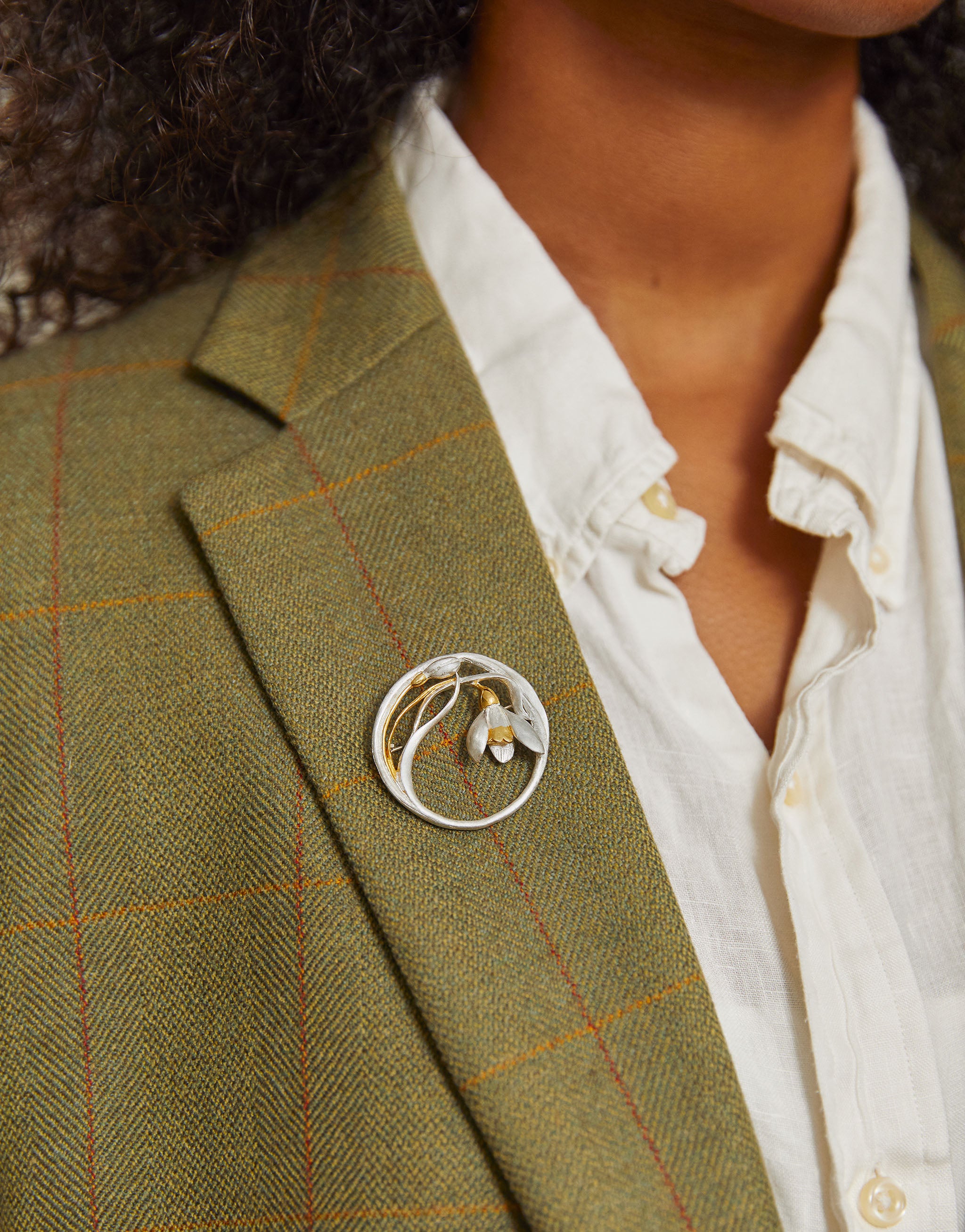 Nature-inspired snowdrop flower brooch handcrafted in silver and gold plate.
