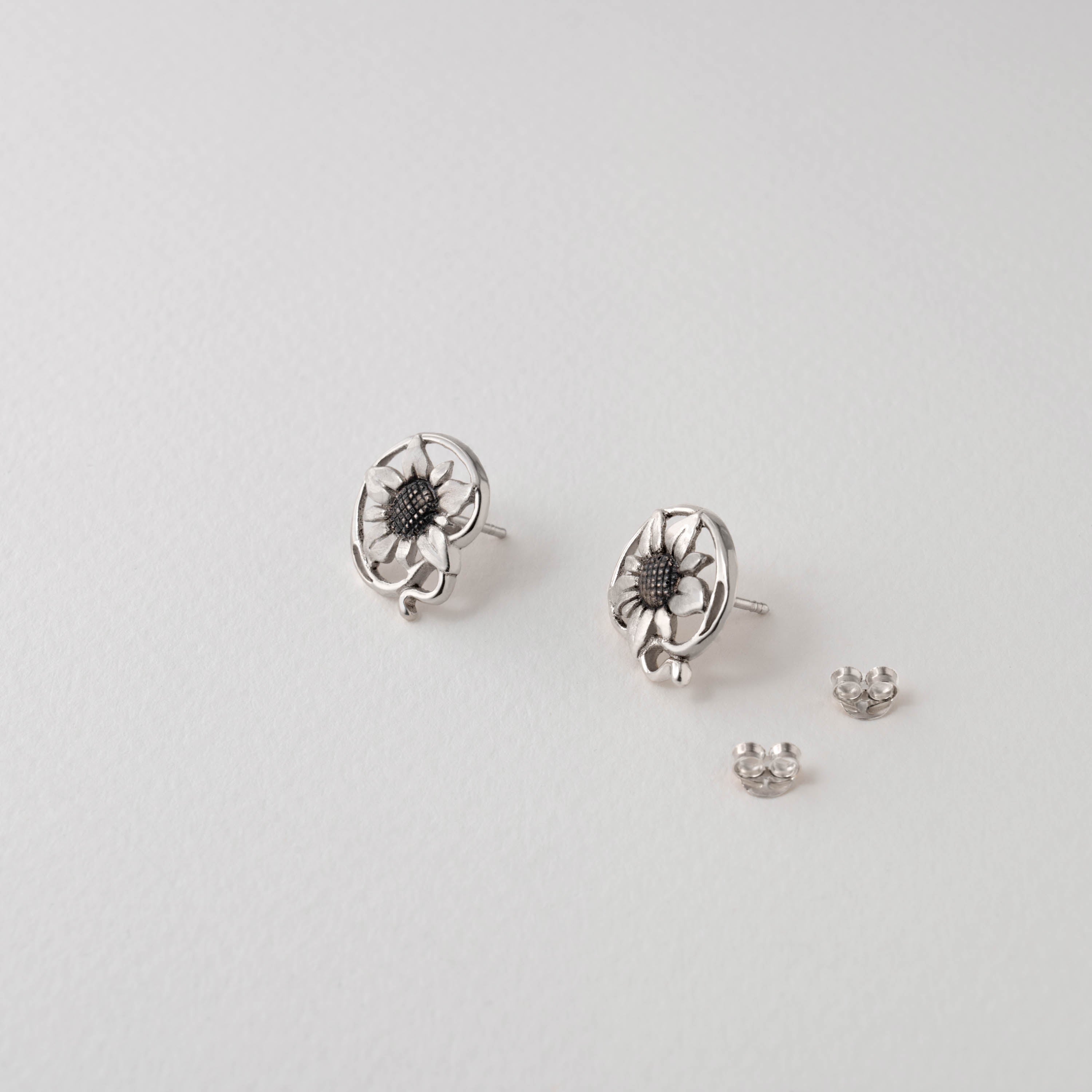 A pair of Van Gogh-inspired sunflower stud earrings in silver