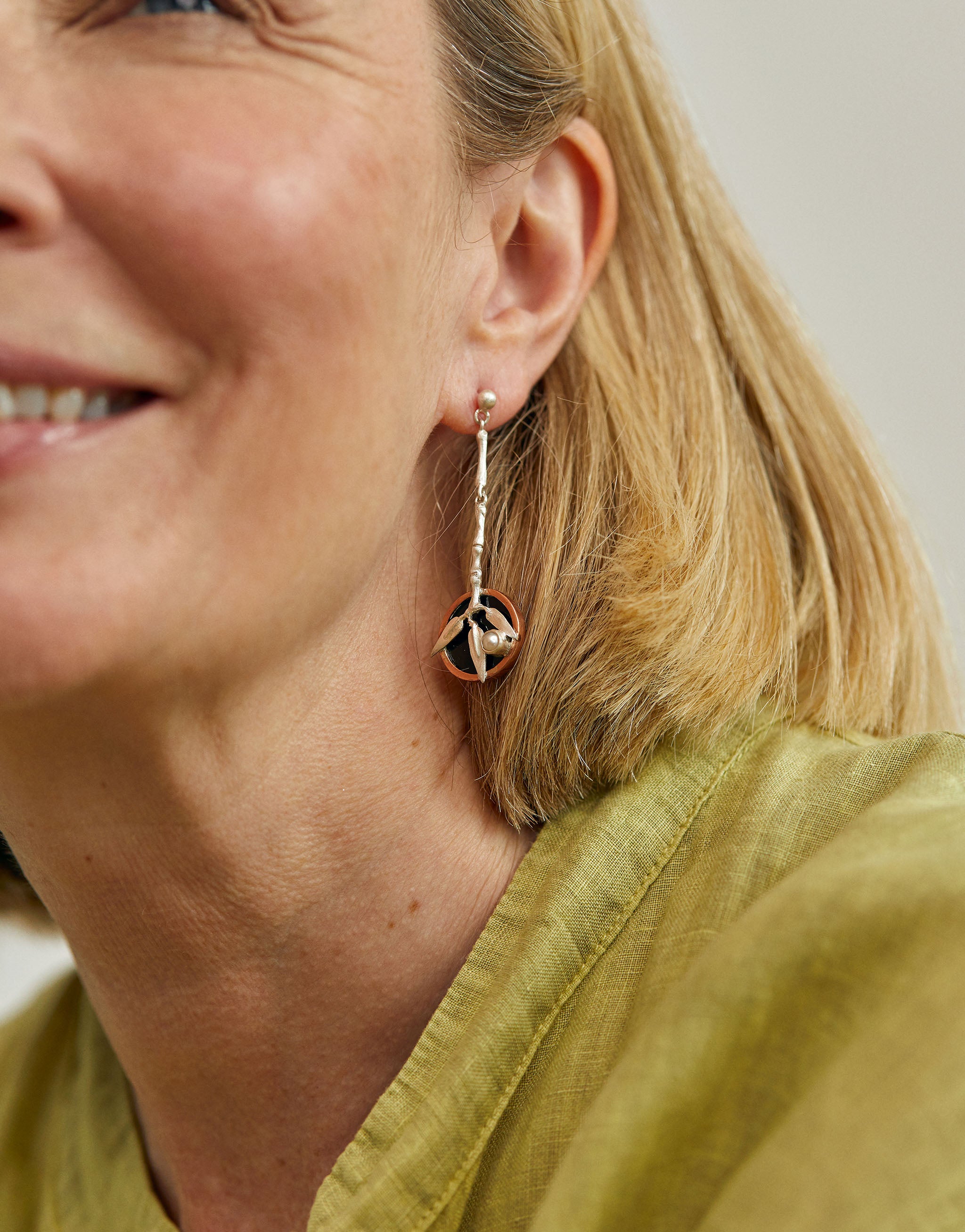 Japanese inspired bamboo earrings with silver branches, resin backdrop and copper accents.