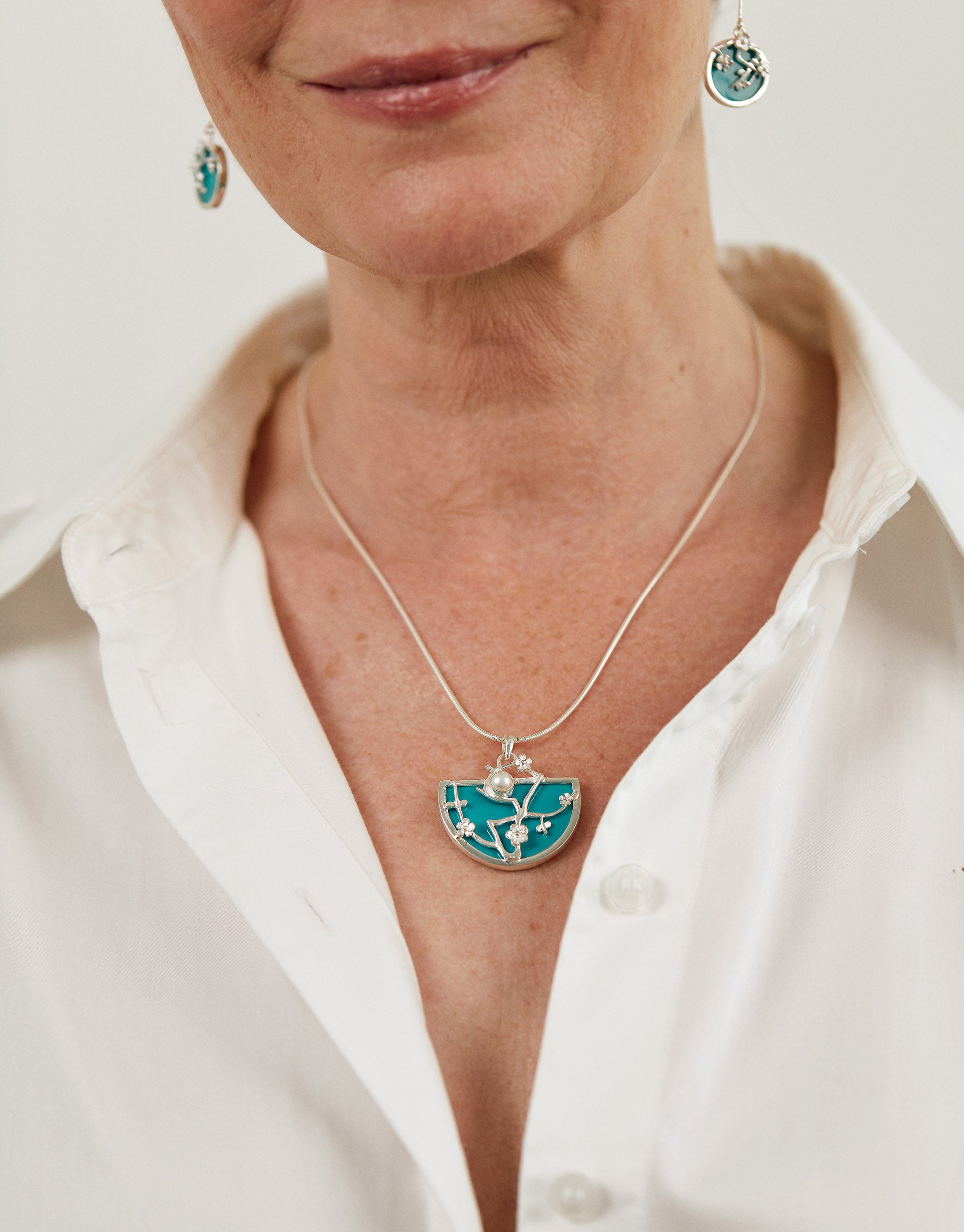 Van Gogh Almond Blossom necklace in sterling silver with blue resin pendant.