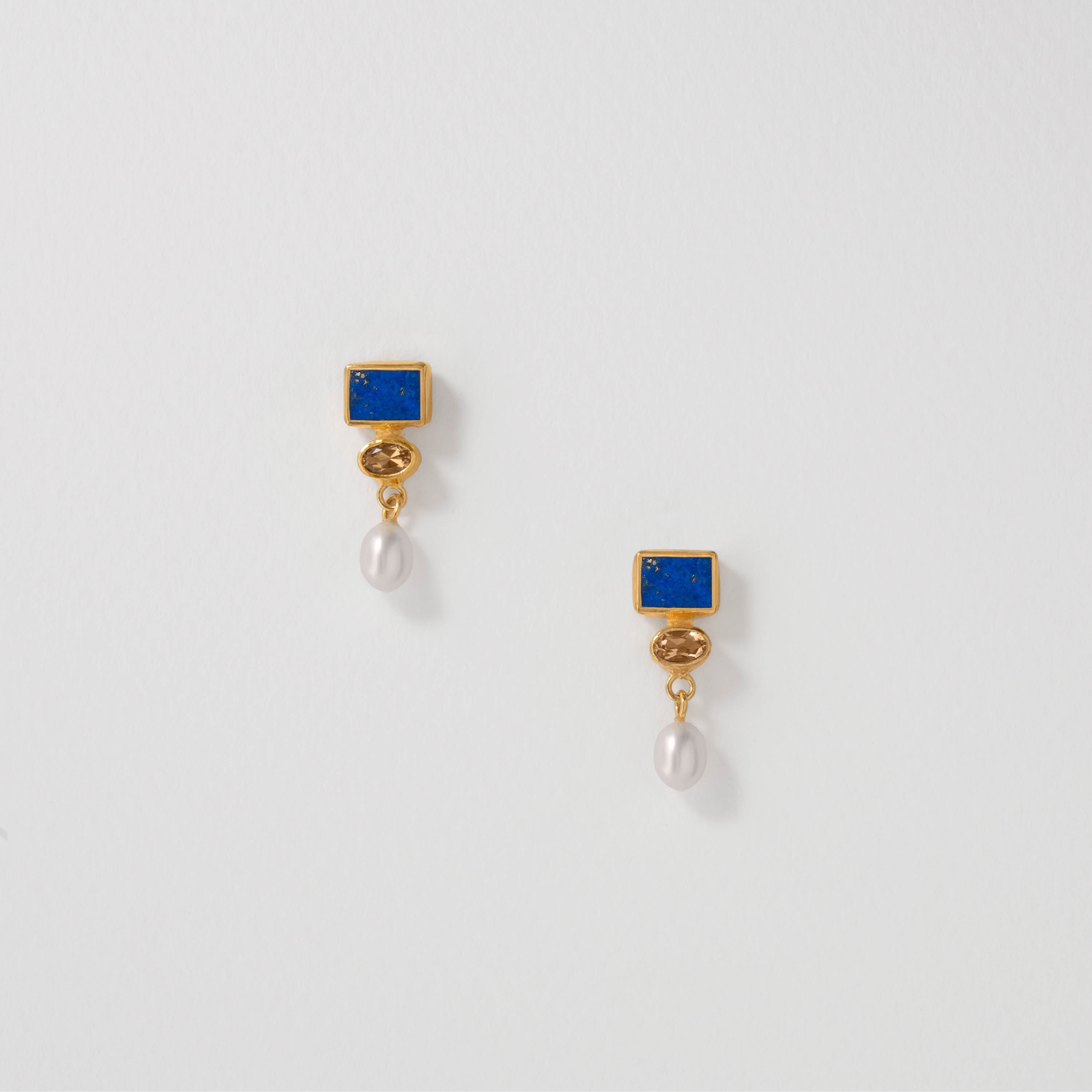 Vermeer inspired drop earrings in 18ct gold plate with lapis lazuli, citrine and freshwater pearls. Designed to echo the luminous tones of Vermeer’s paintings, these earrings blend artistic heritage with timeless elegance.