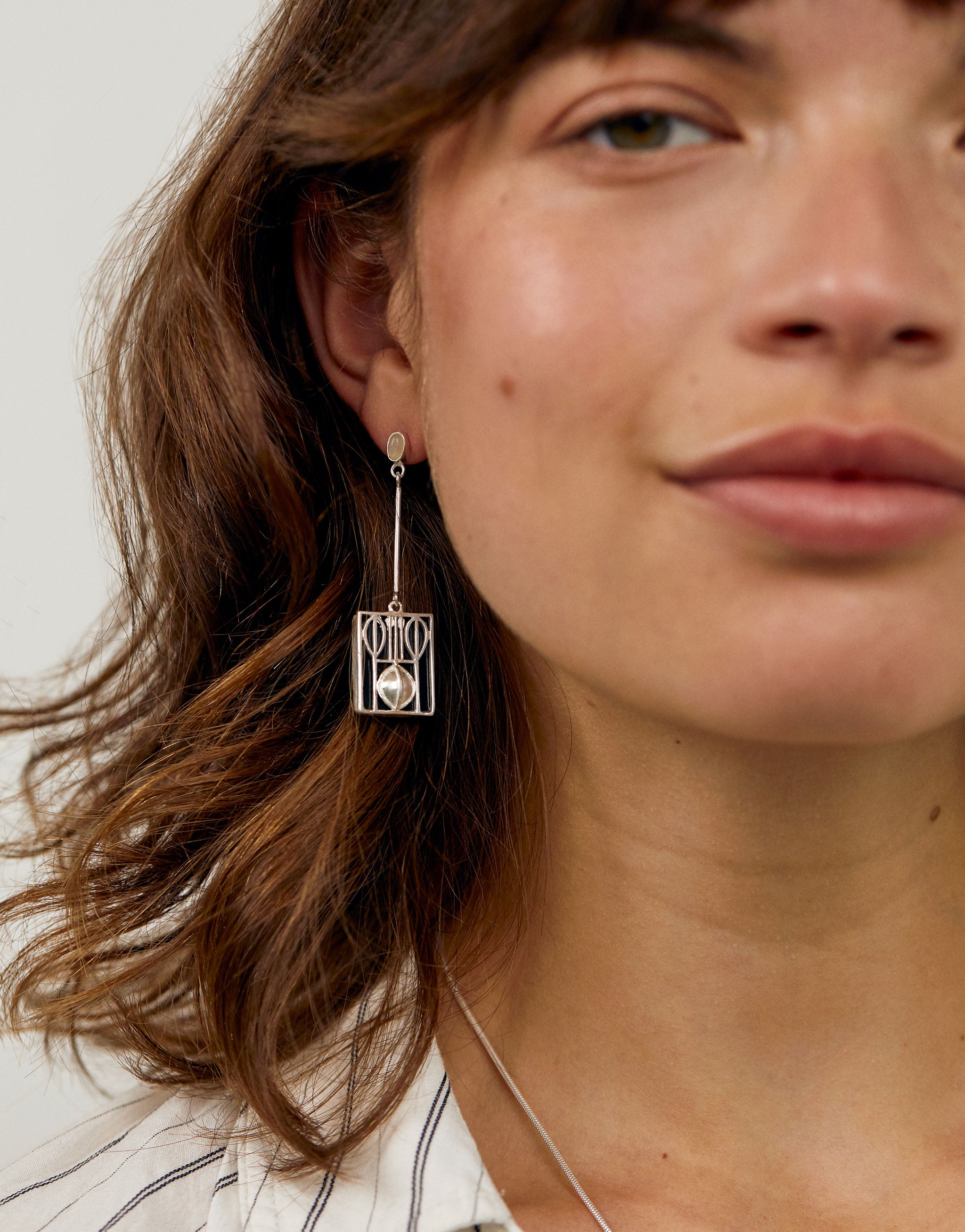 Geometric earrings inspired by the Wiener Werkstätte, crafted in sterling silver with bold modernist design. Elegant statement jewellery reflecting early 20th century craftsmanship and abstract beauty.