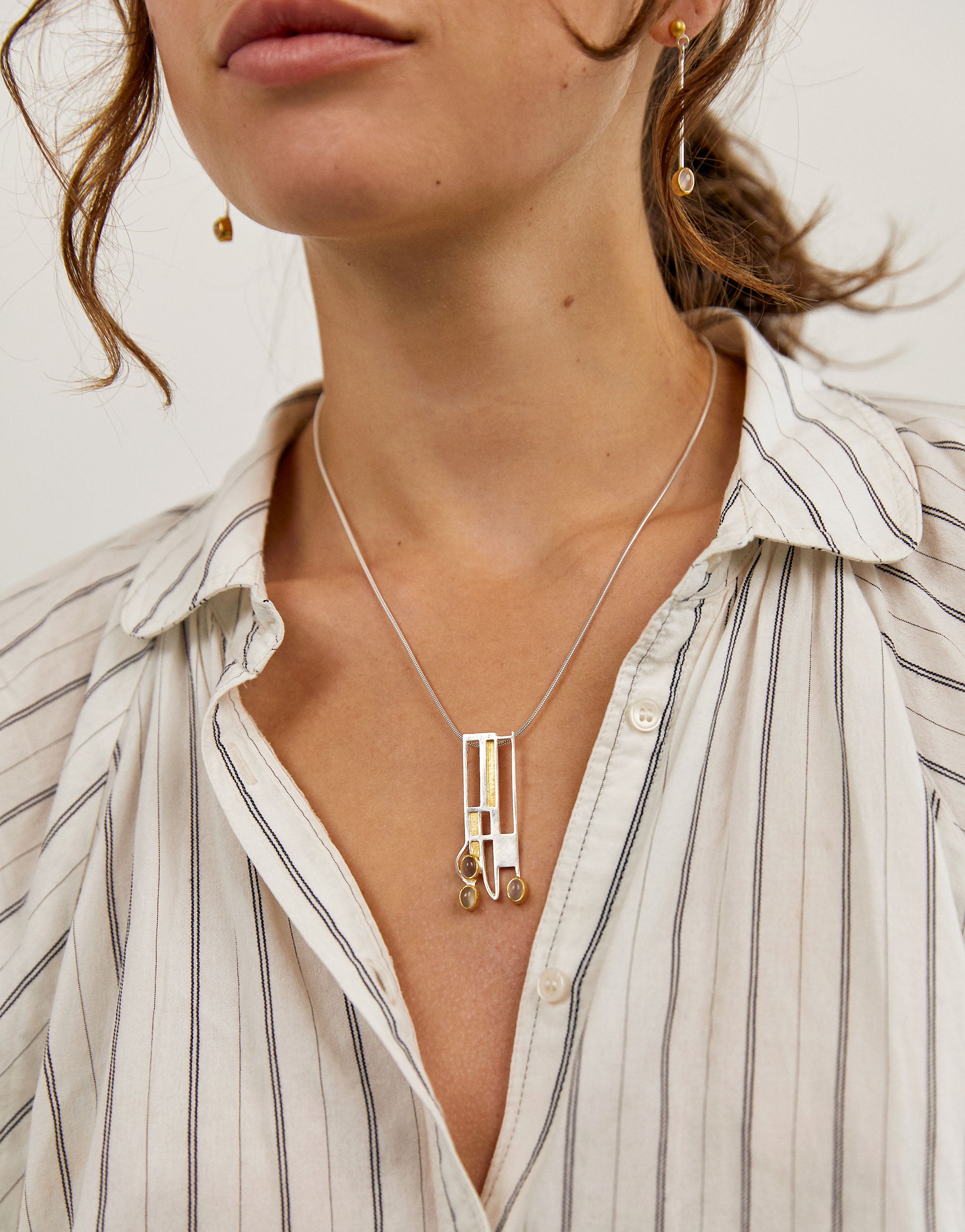 Art Nouveau style Mackintosh pendant necklace with silver, gold accents and moonstone gemstone.
