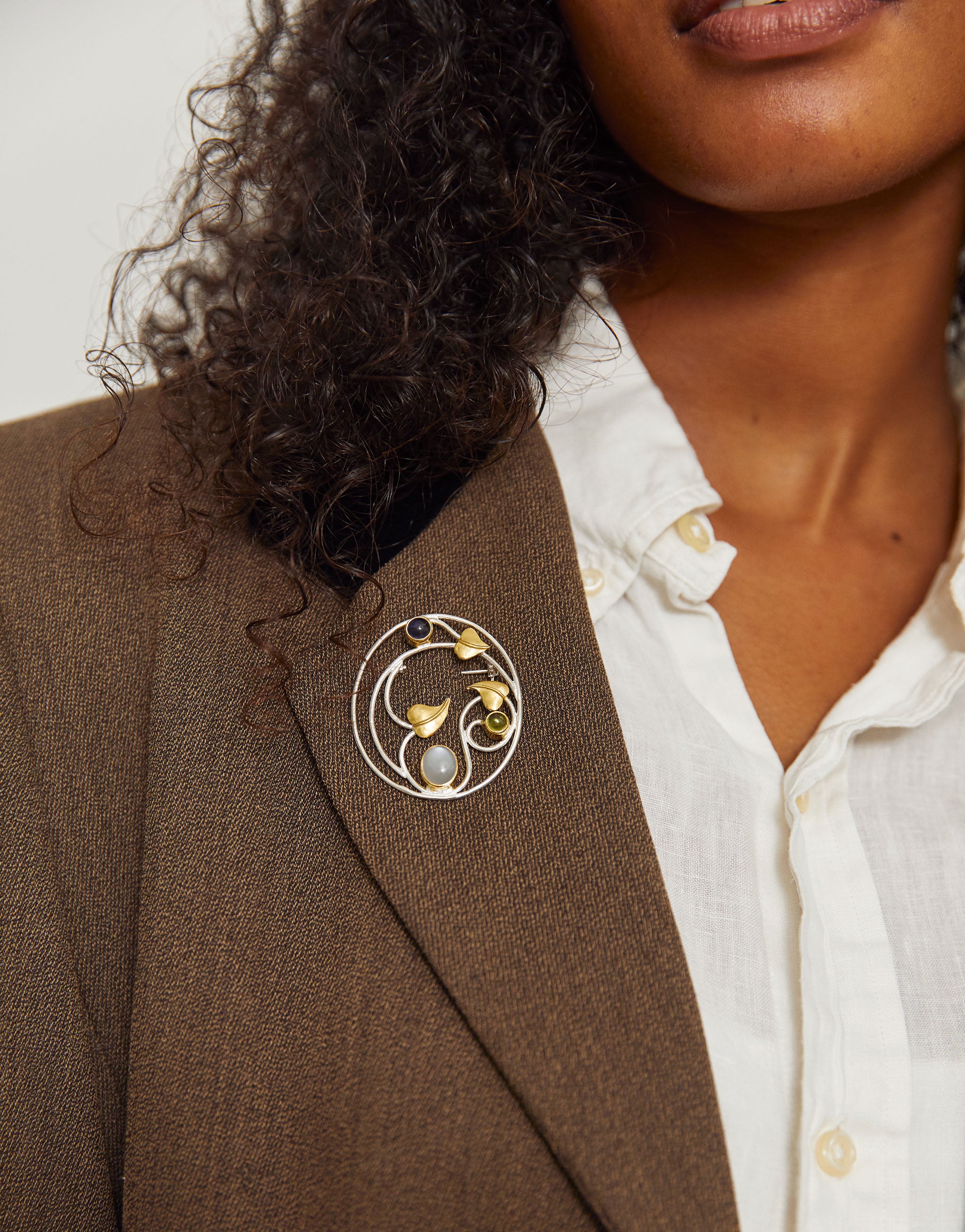 Margaret Macdonald Willowwood brooch in sterling silver with iolite, peridot, moonstone and gold-plated detail.