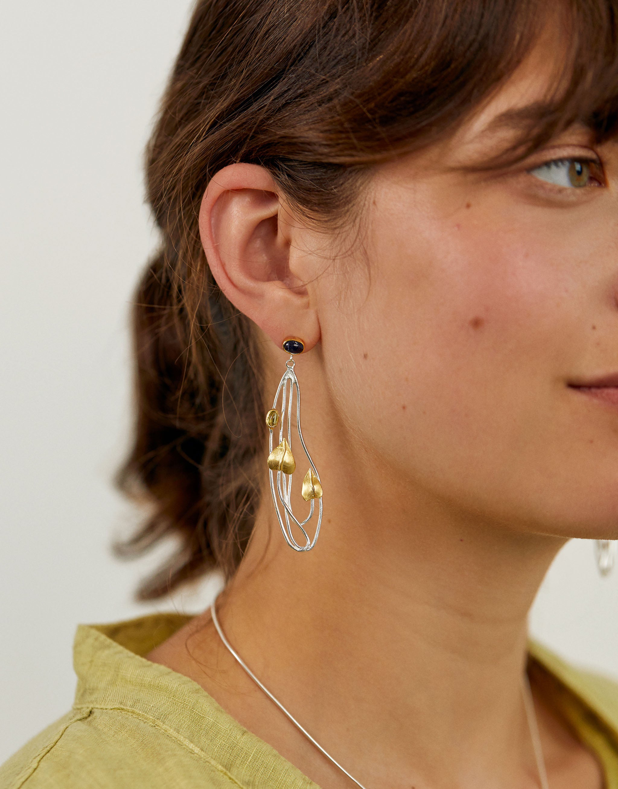 Art Nouveau earrings in silver, 18ct gold plate. Finished with Iolite and Peridot.