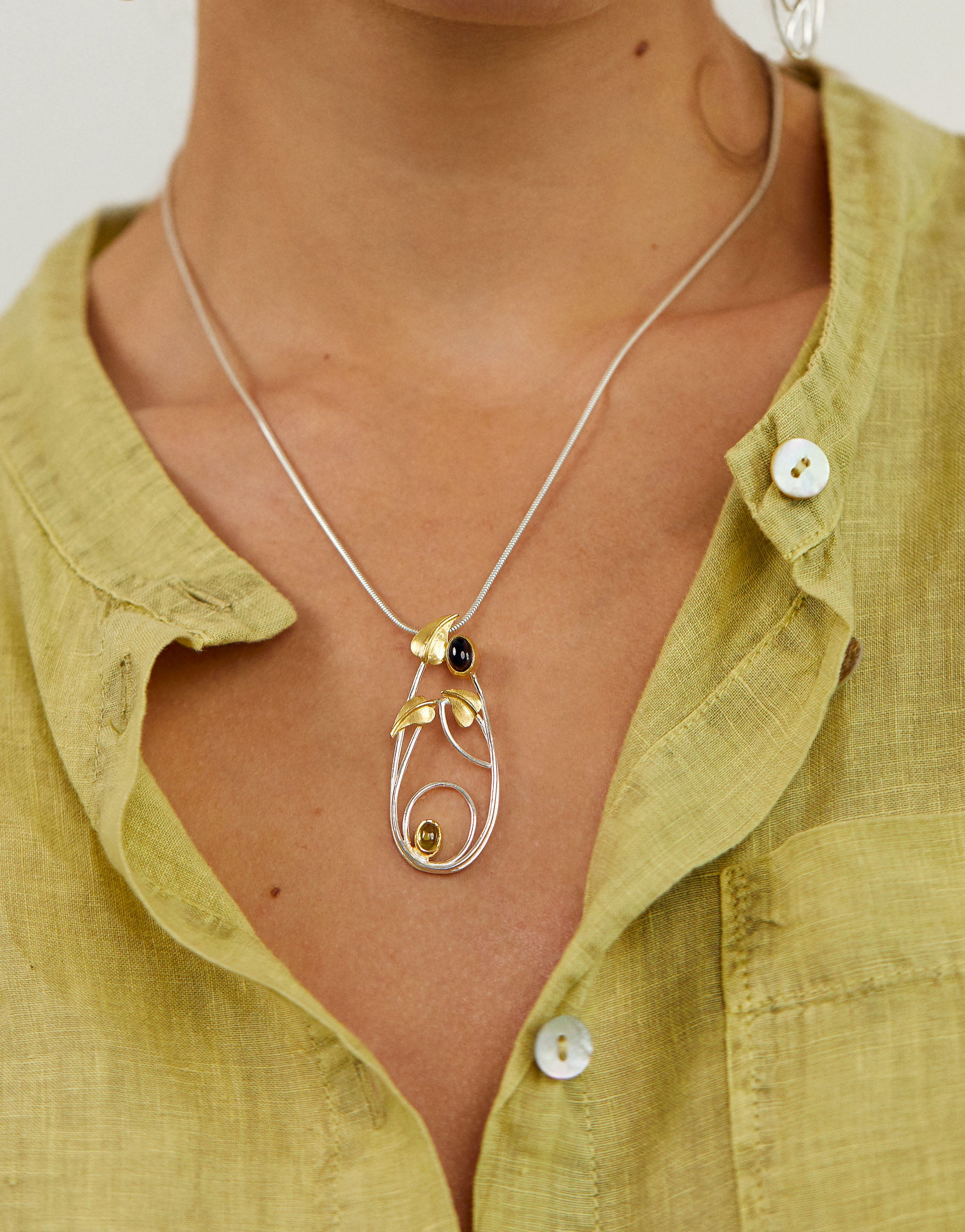 Sterling silver and gold-plated Macdonald Willow Tea Rooms inspired necklace featuring iolite and peridot.