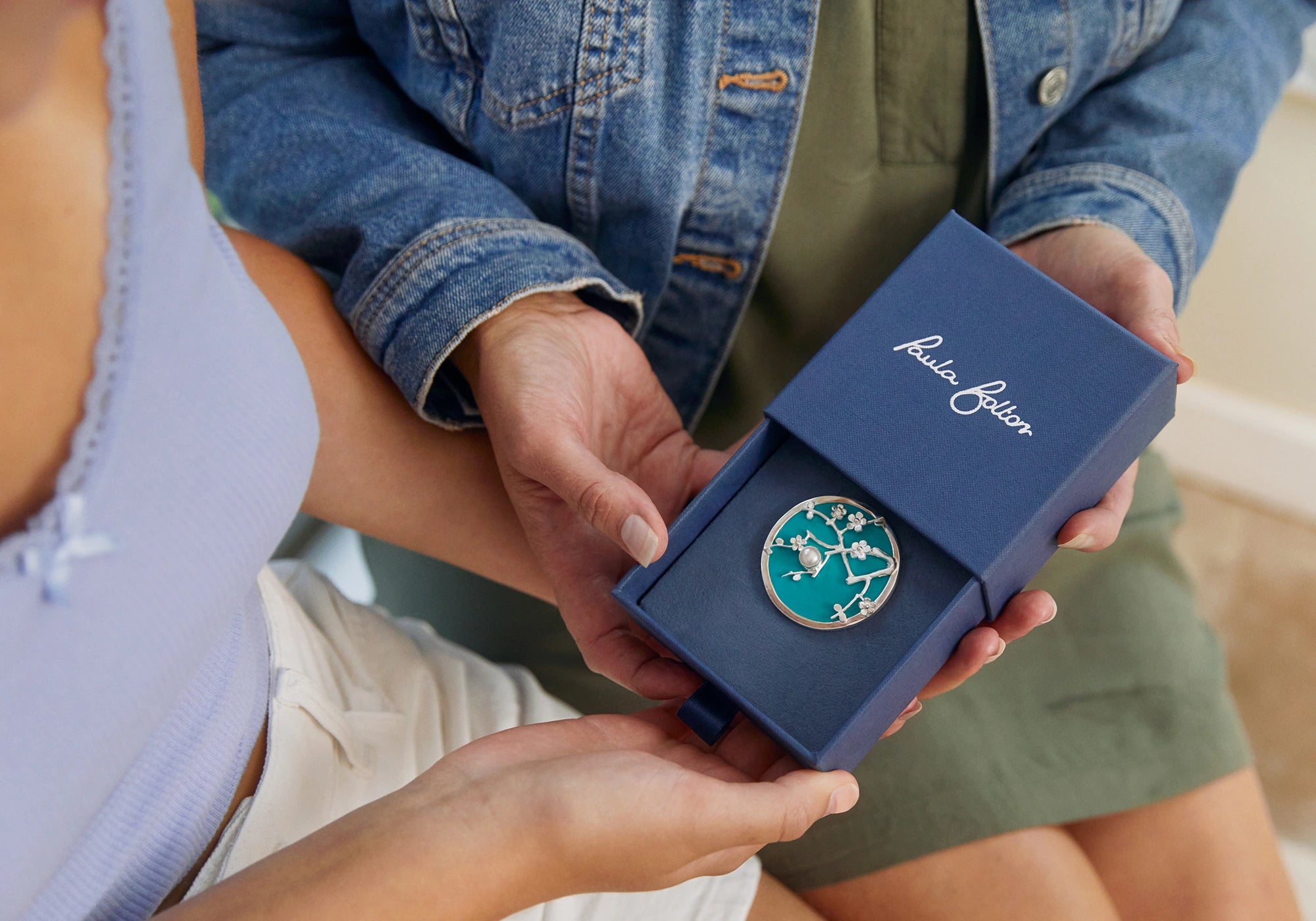 silver brooch in keepsake box