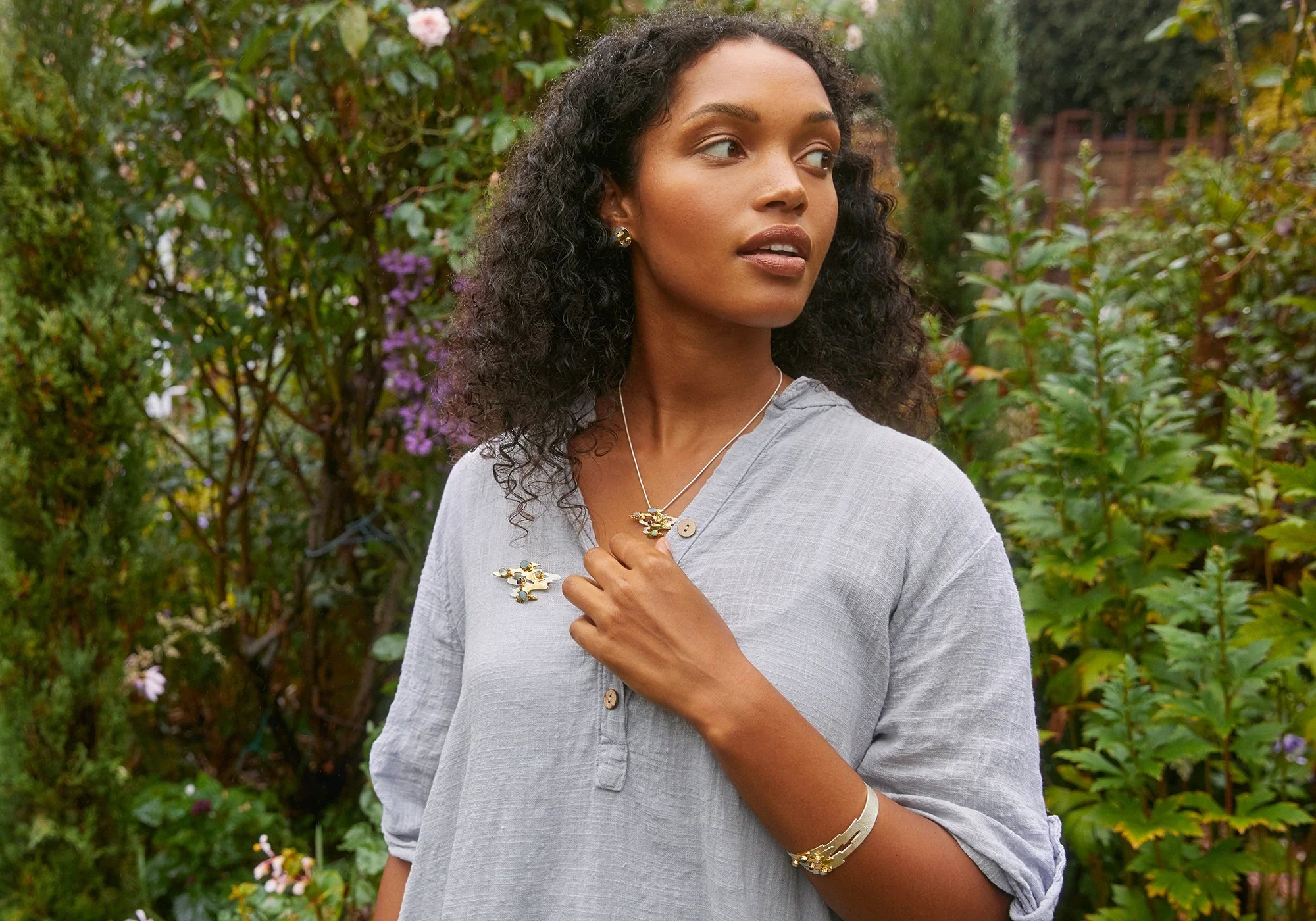 Model wearing gold and silver mixed metal jewellery pieces