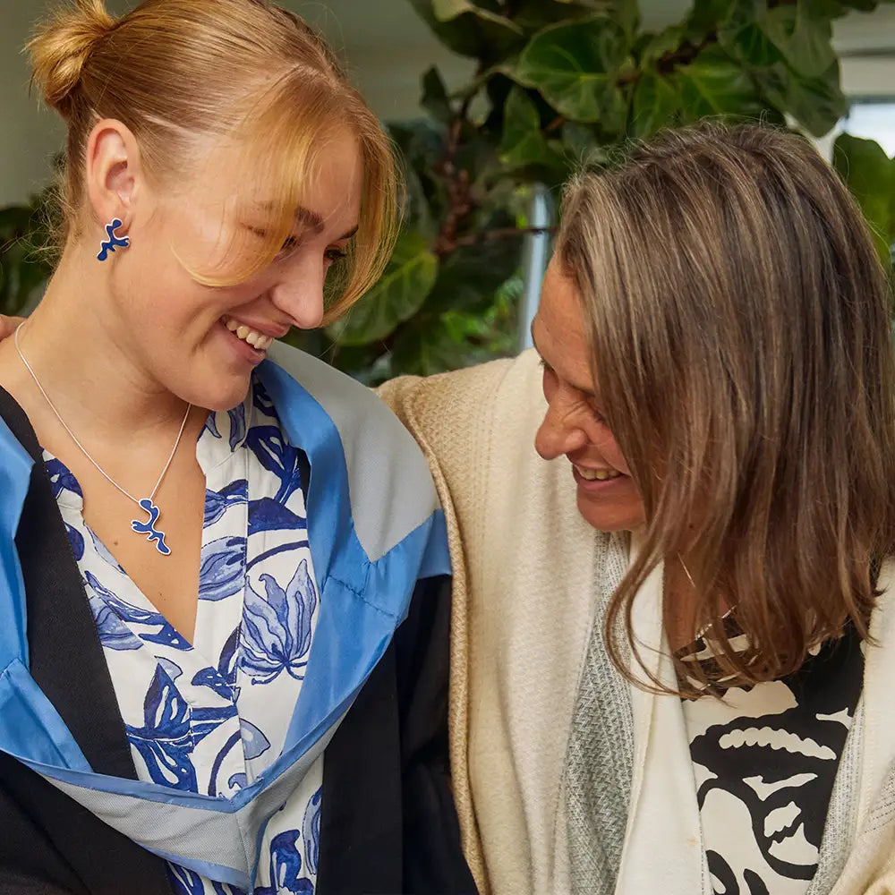 mother with daughter wearing graduation jewellery