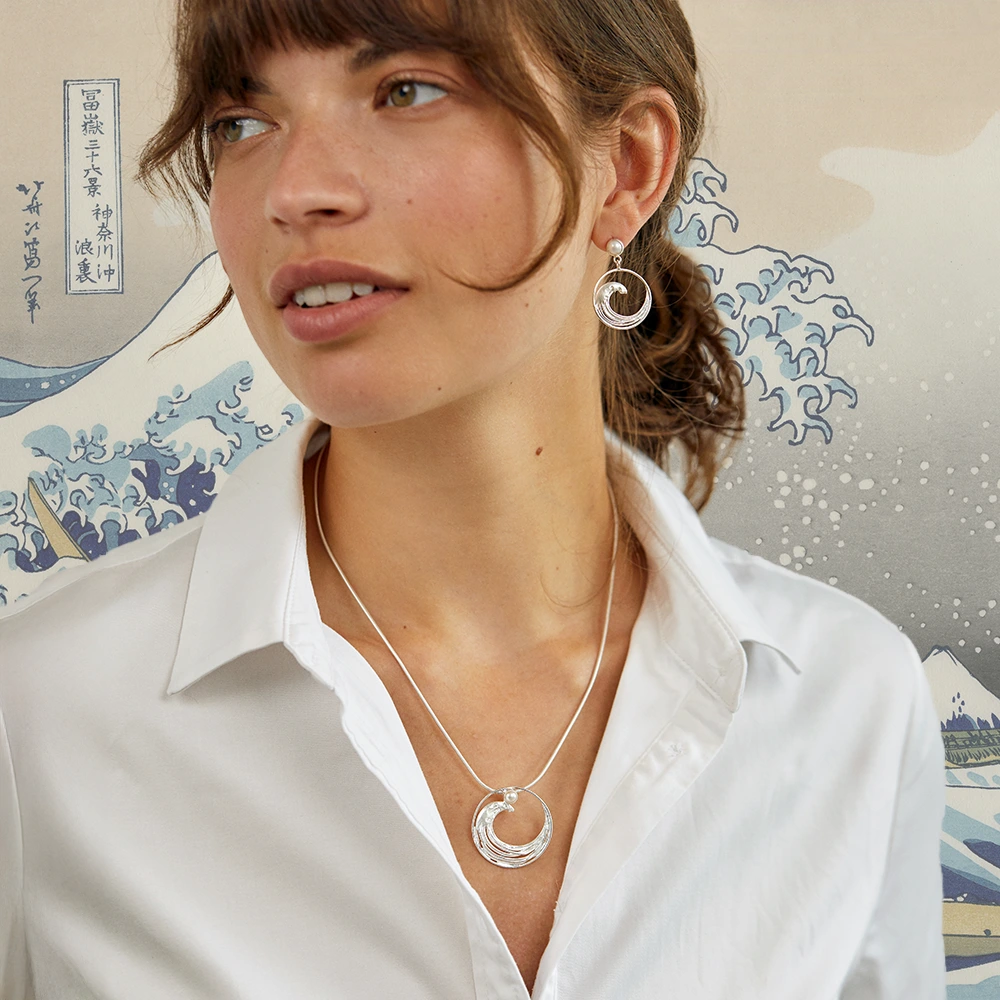A sterling silver Hokusai wave pendant necklace.